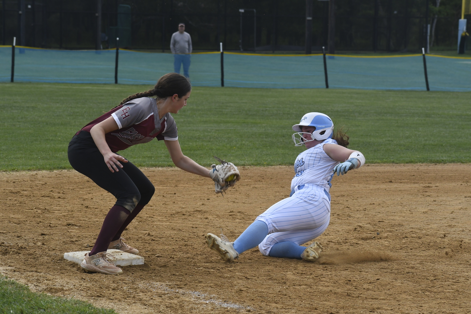 Bonac third baseman Alexa Schaffer applies a tag to a Rocky Point base runner trying to reach third for an out.   DREW BUDD
