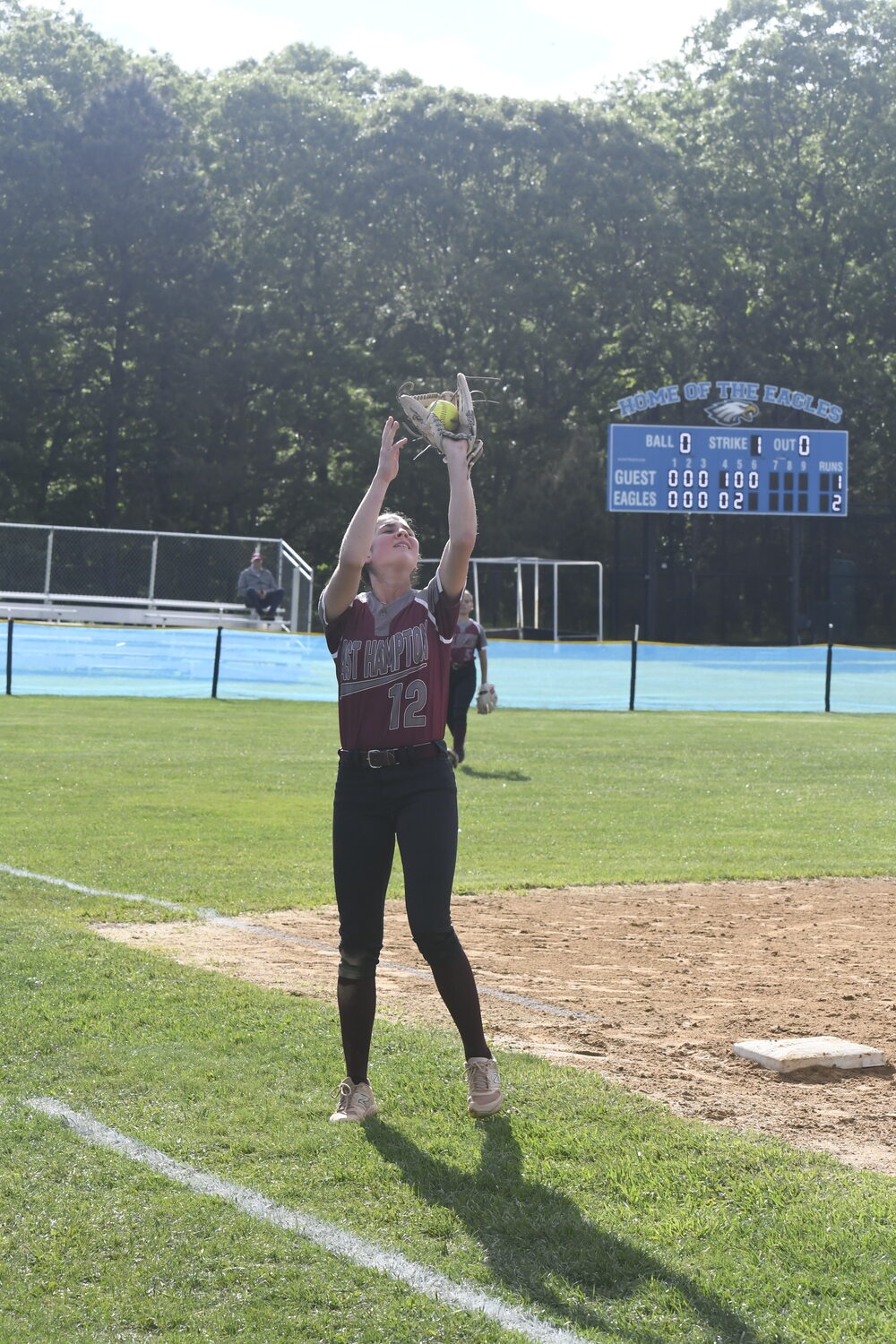 Alexa Schaffer catches a fly ball in foul territory for an out.  DREW BUDD