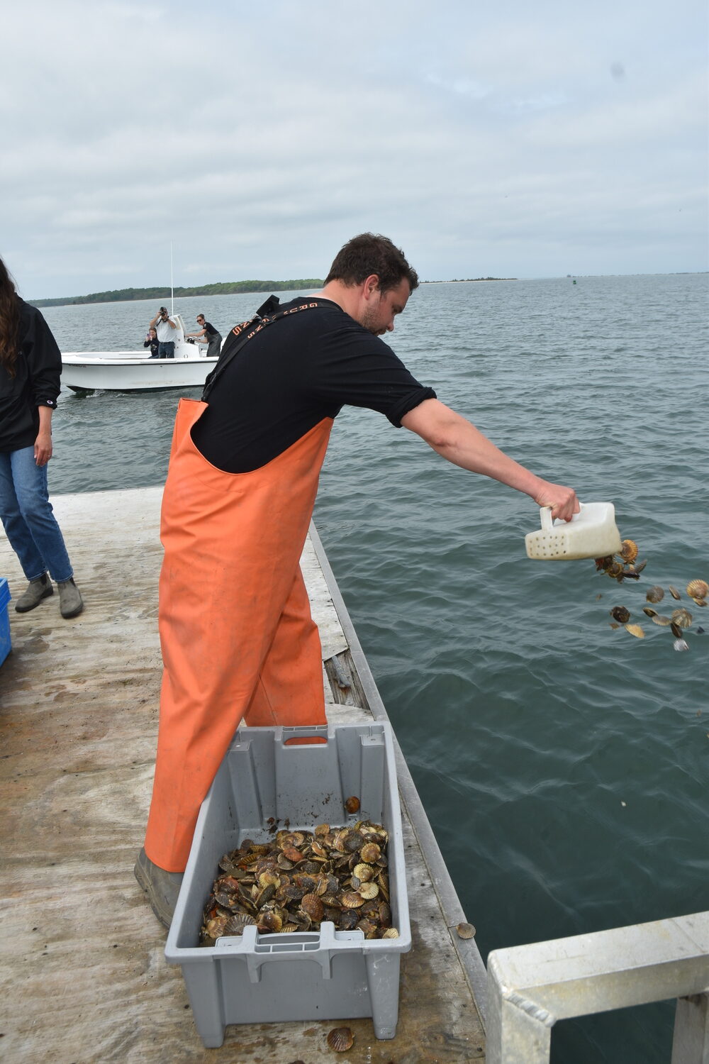 Harrison Tobi seeds scallops. STEPHEN J. KOTZ