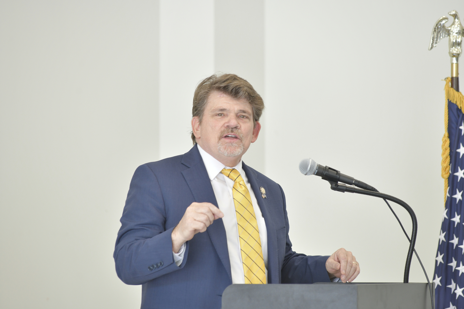 Assemblyman tommy John Schiavoni addresses the crowd at the Southampton Volunteer Ambulance building dedication on Sunday.  DANA SHAW