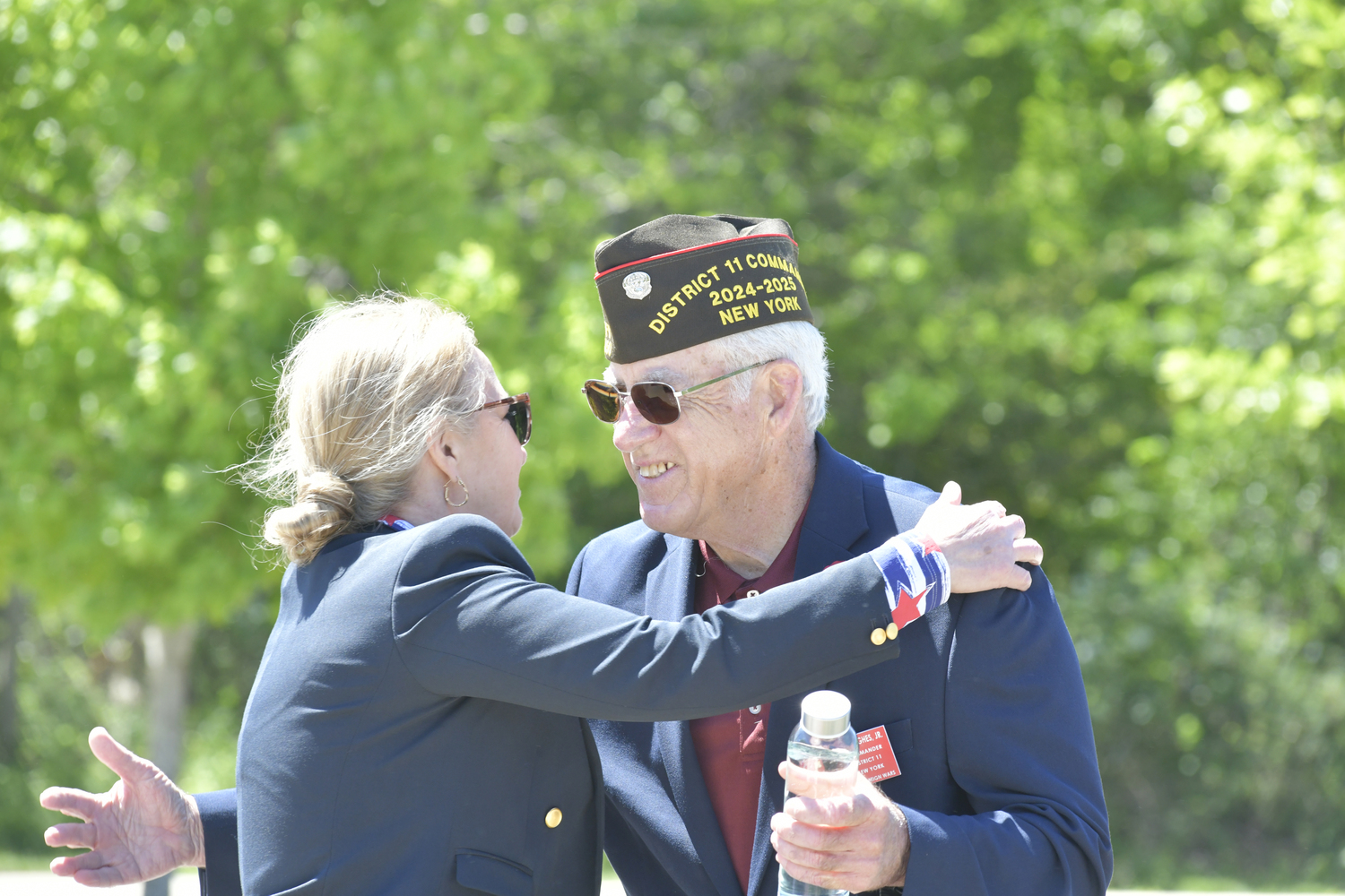 Southampton Town Clerk Sundy Schermeyer hugs VFW Post 5350 Commander William Hughes at the 