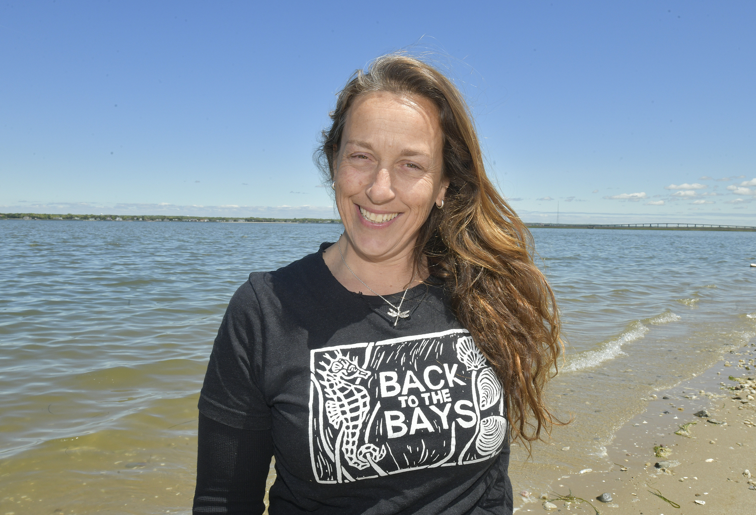 Artist and educator Carolyn Munaco at the Tiana bayside in Hampton Bays.  DANA SHAW