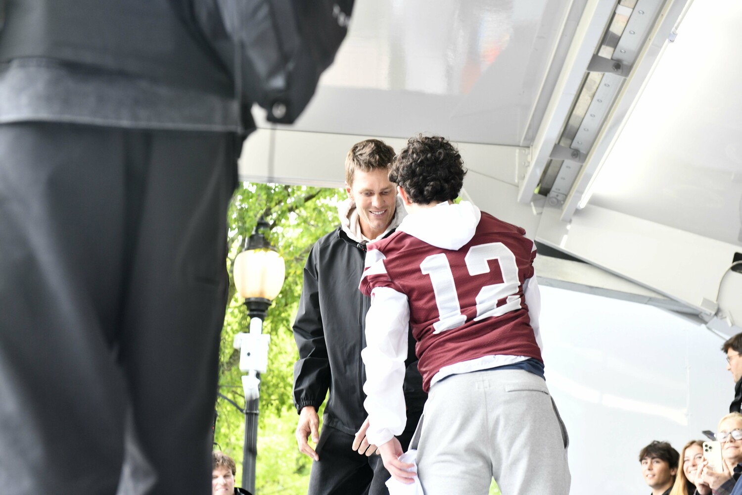 Bonac quarterback Theo Ball onstage with Tom Brady.  DANA SHAW