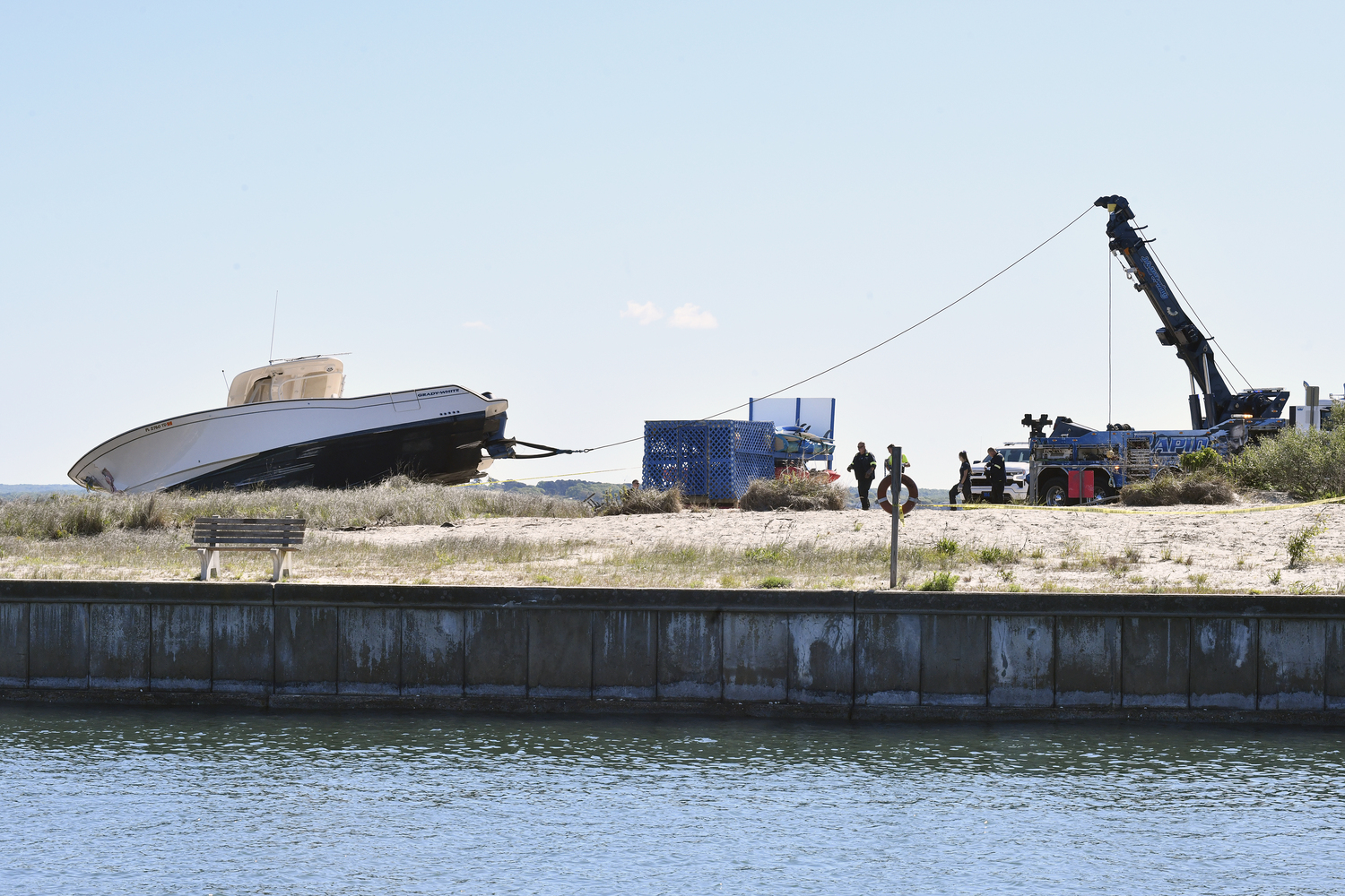 The 33 foot Grady White was being removed from the beach at Meschutt Beach County Park on Monday morning. DANA SHAW