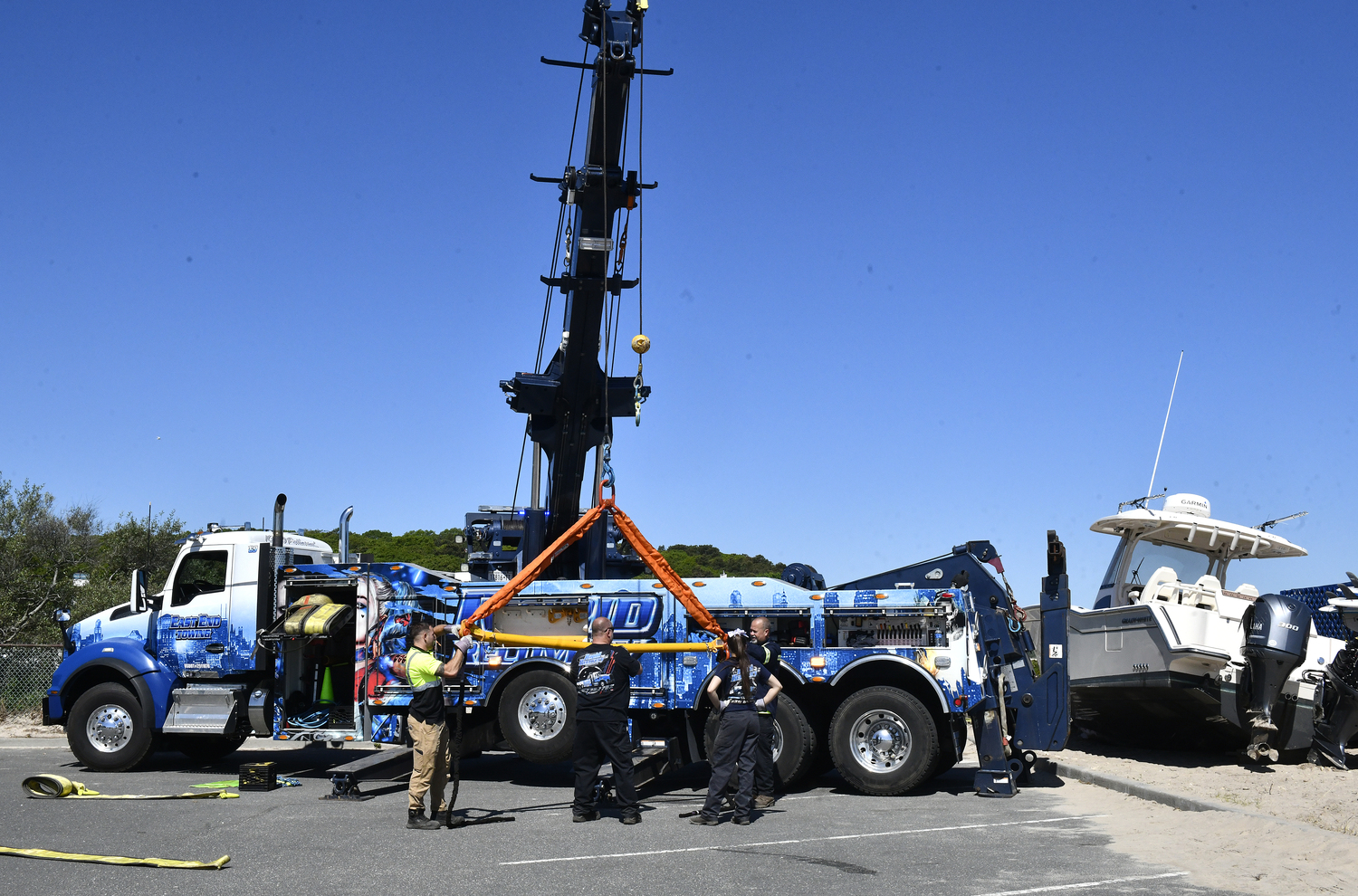 The 33 foot Grady White was being removed from the beach at Meschutt Beach County Park on Monday morning. DANA SHAW