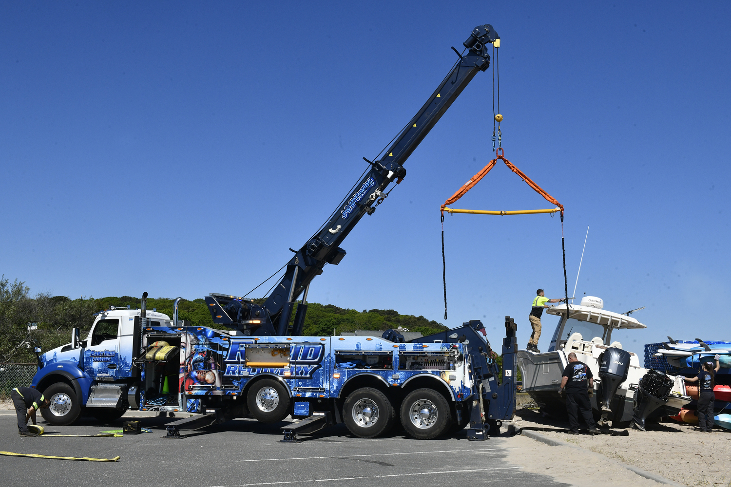 The 33 foot Grady White was being removed from the beach at Meschutt Beach County Park on Monday morning. DANA SHAW
