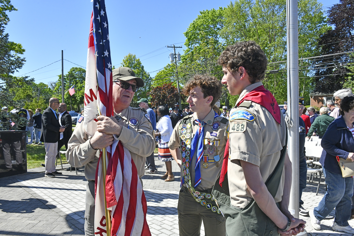 Frank Morro with Marcus and Magnus Haynia from Troop 483 at the Hampton Bays Memorial Day services on Monday.  DANA SHAW