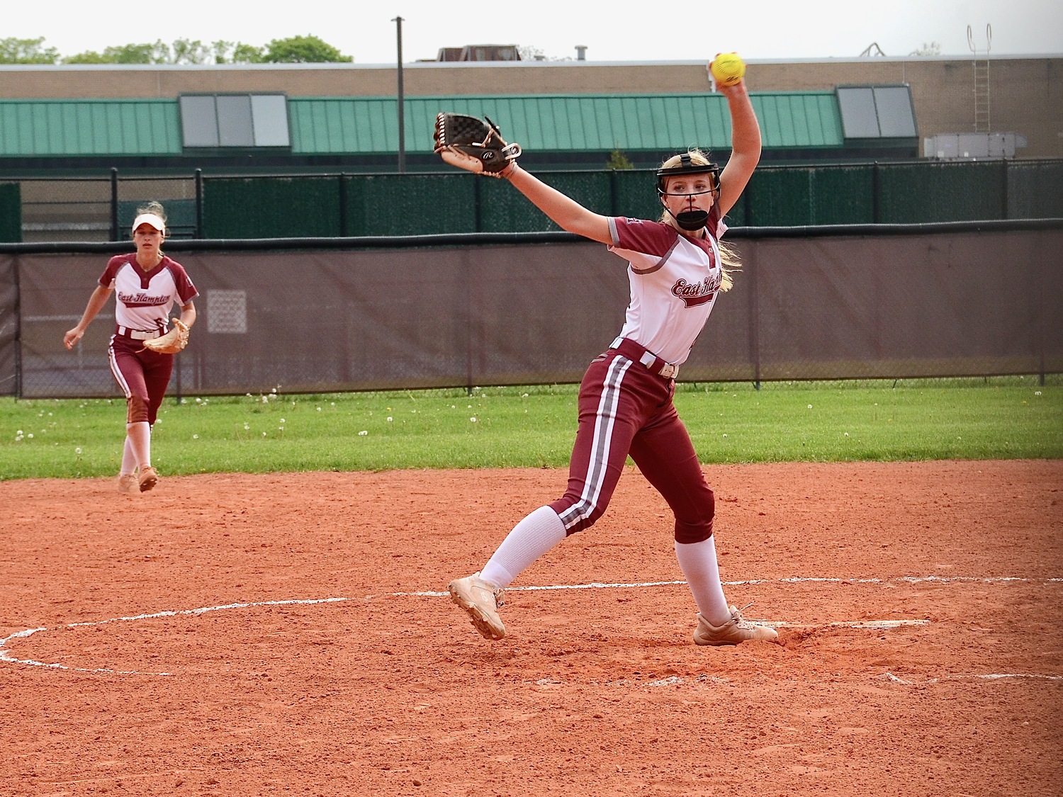 Sophomore Lydia Rowan winds up to toss a pitch. KYRIL BROMLEY