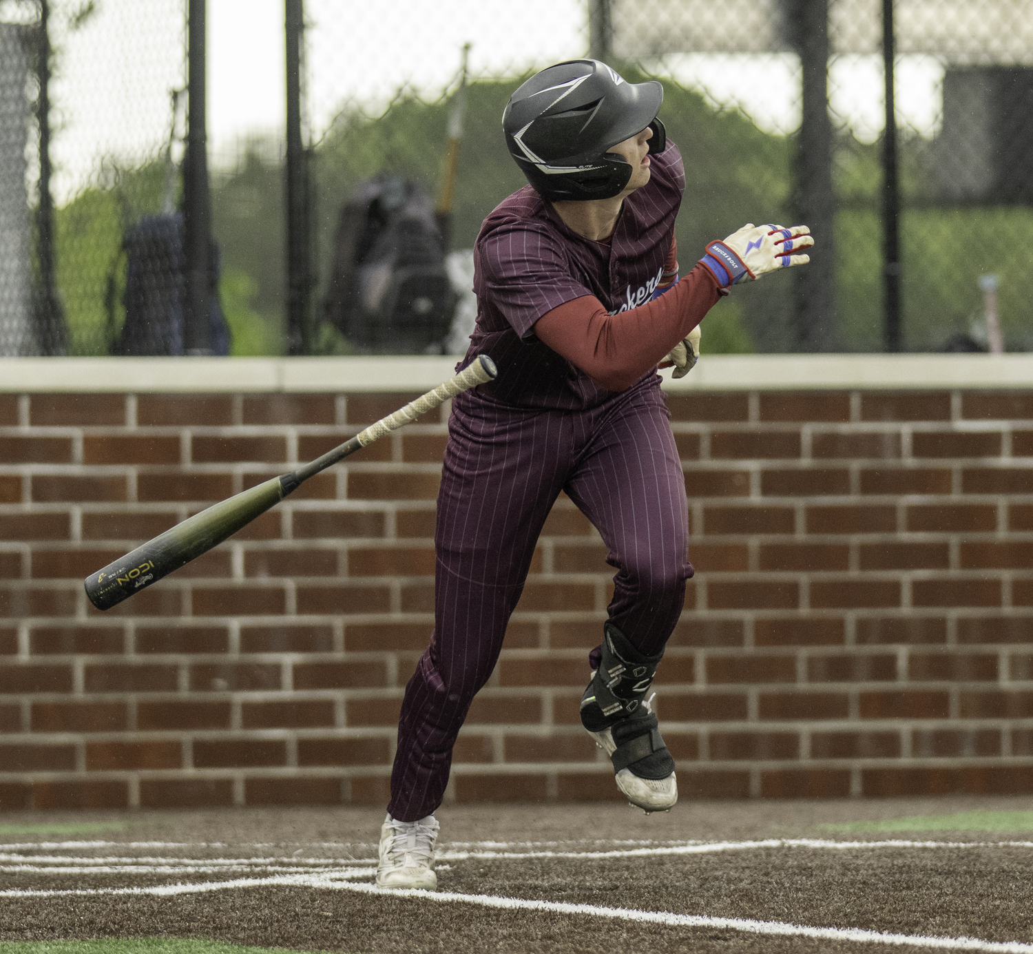 Mason Miles watches his home run take flight. 
MARIANNE BARNETT