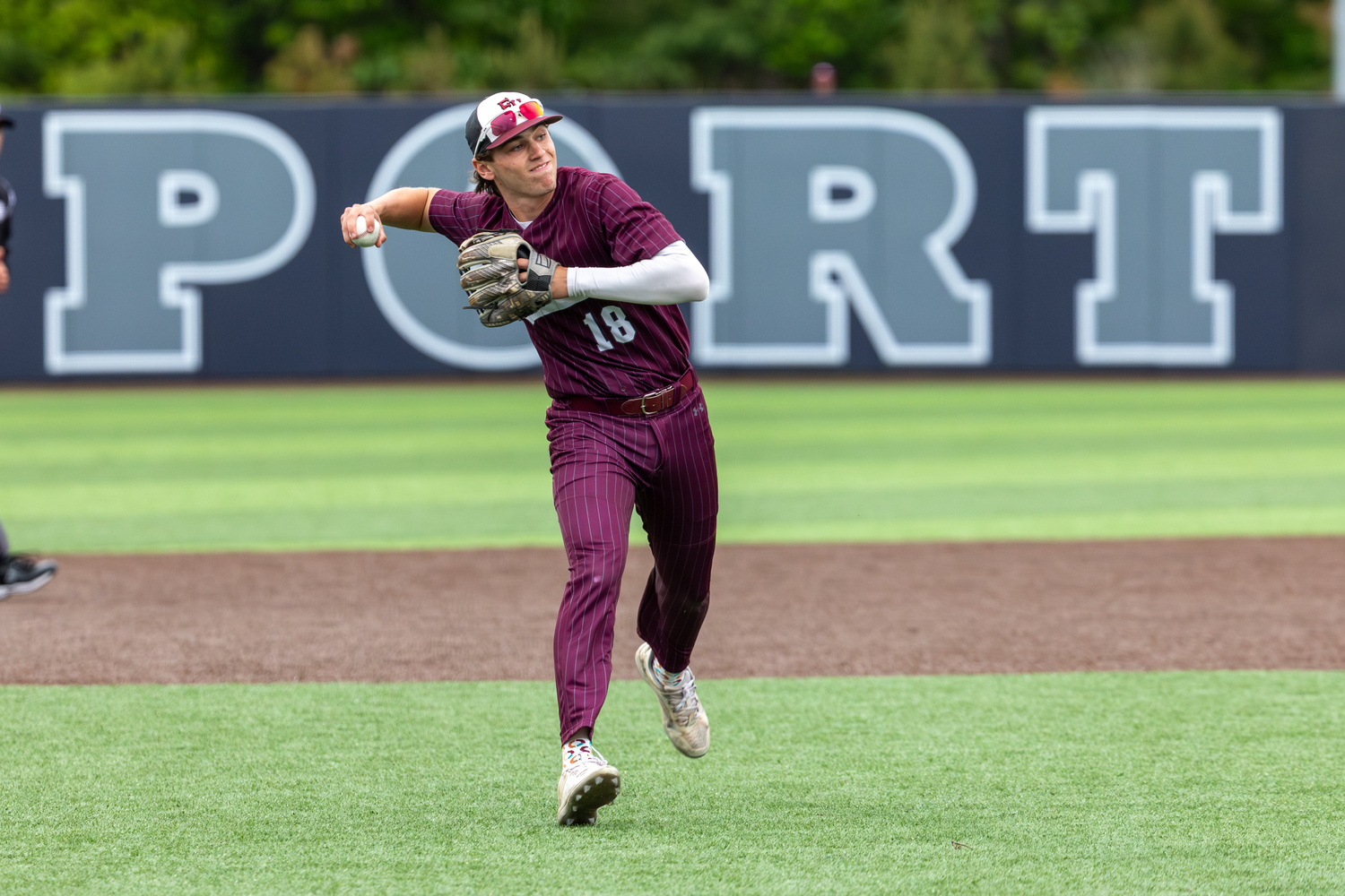 East Hampton third baseman Mason Miles tries to make a play on a bouncing ground ball in the infield.  RON ESPOSITO