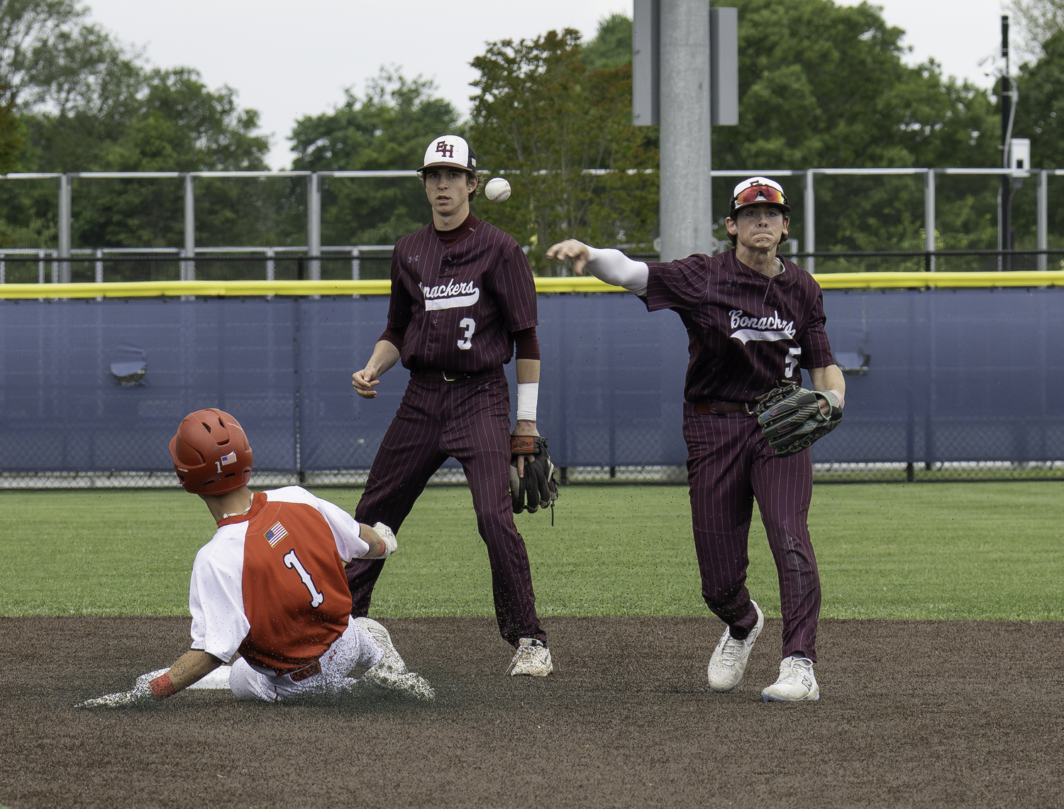 East Hampton senior Hudson Meyer tries to turn a double play.  MARIANNE BARNETT
