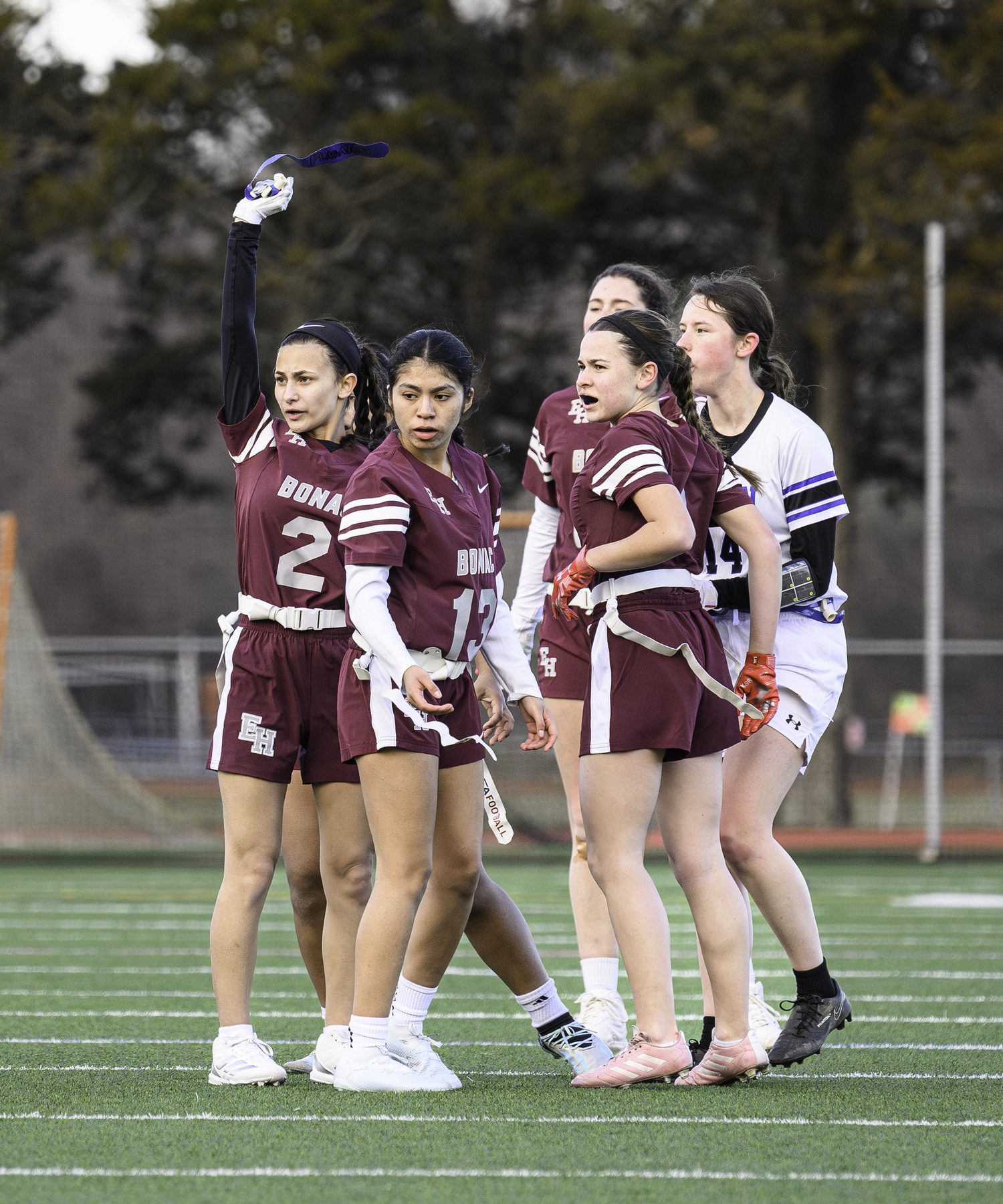 Mary Jo Corron picks up a flag during the Bonacker's season opener on March 26.  MARIANNE BARNETT