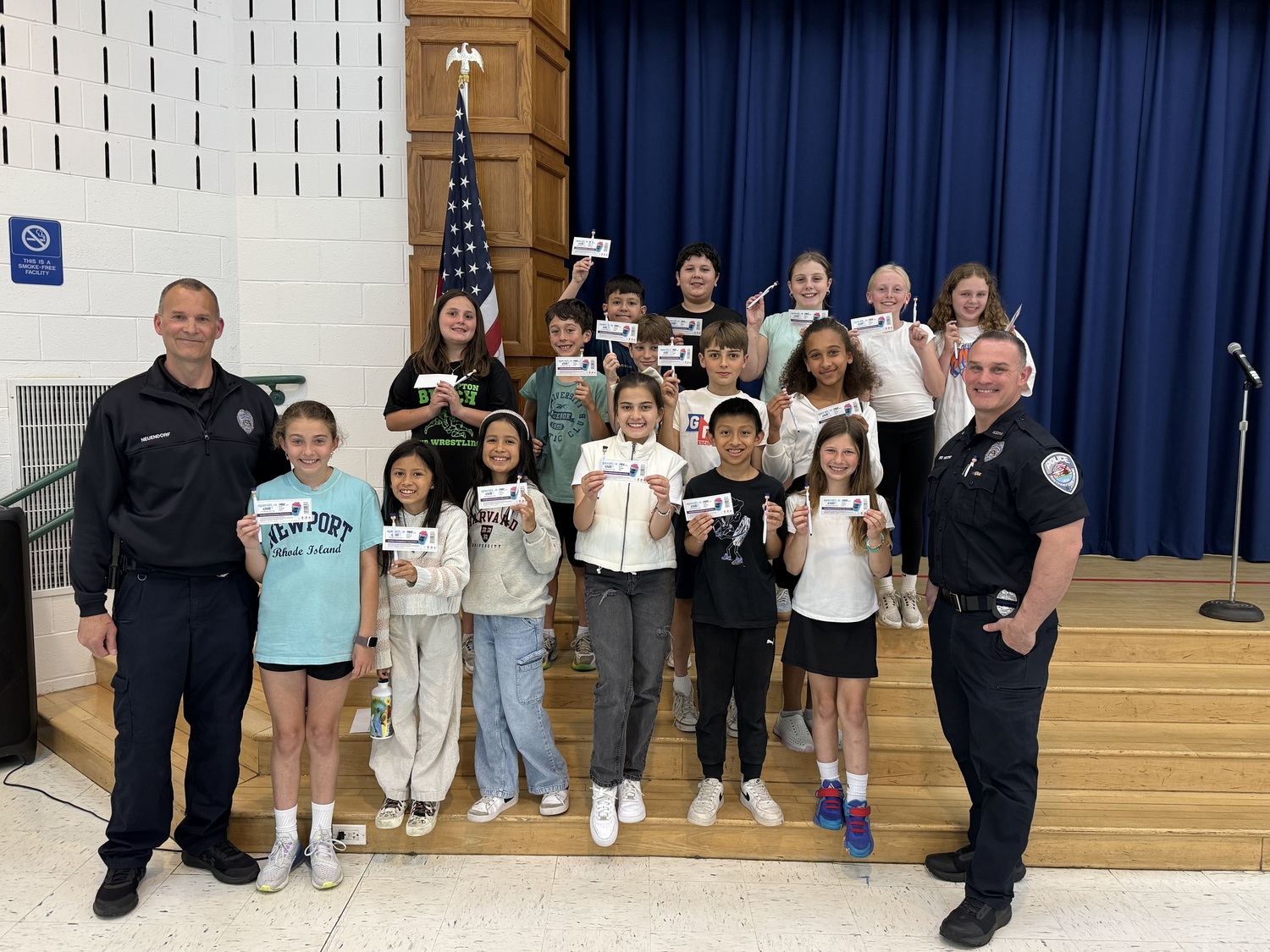 Southampton Police Officer Neuendorf and Southampton Police Officer Vecchio with East Quogue School students after a bike safety presentation. COURTESY EAST QUOGUE SCHOOL DISTRICT