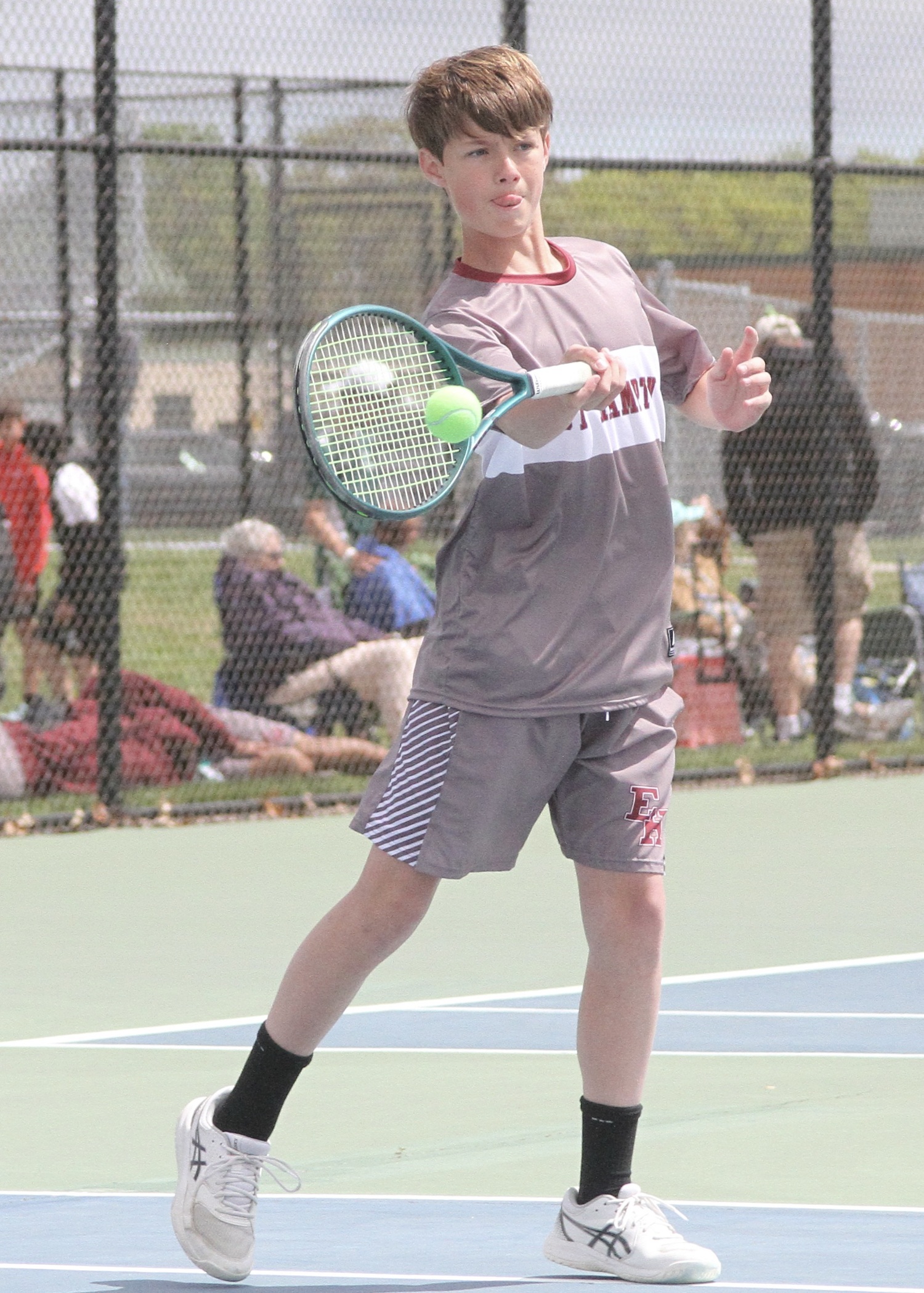 Eighth-grader Chase Bohnnsack sends the ball back over the net. DESIRÉE KEEGAN