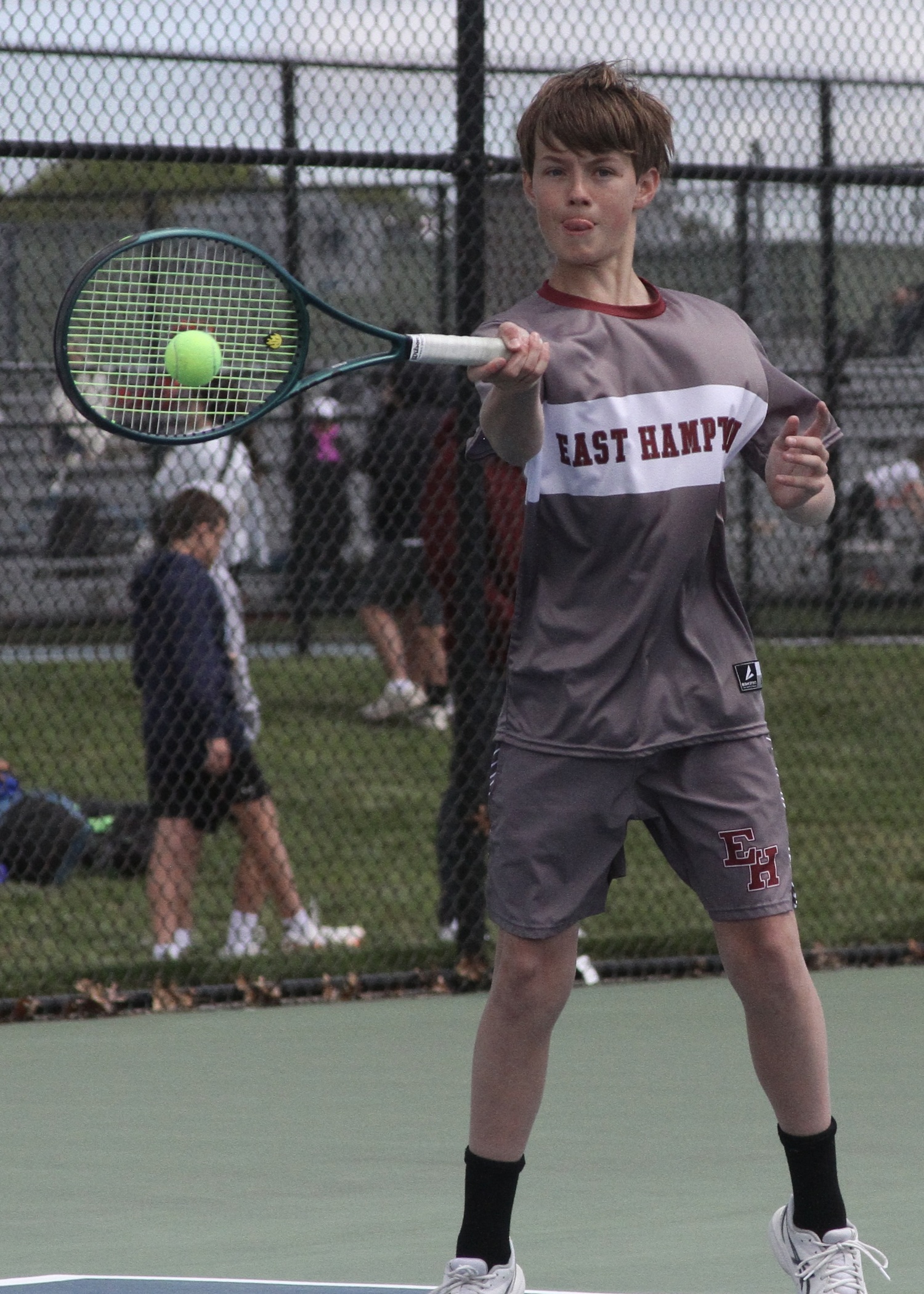 Eighth-grader Chase Bohnnsack returns a serve. DESIRÉE KEEGAN