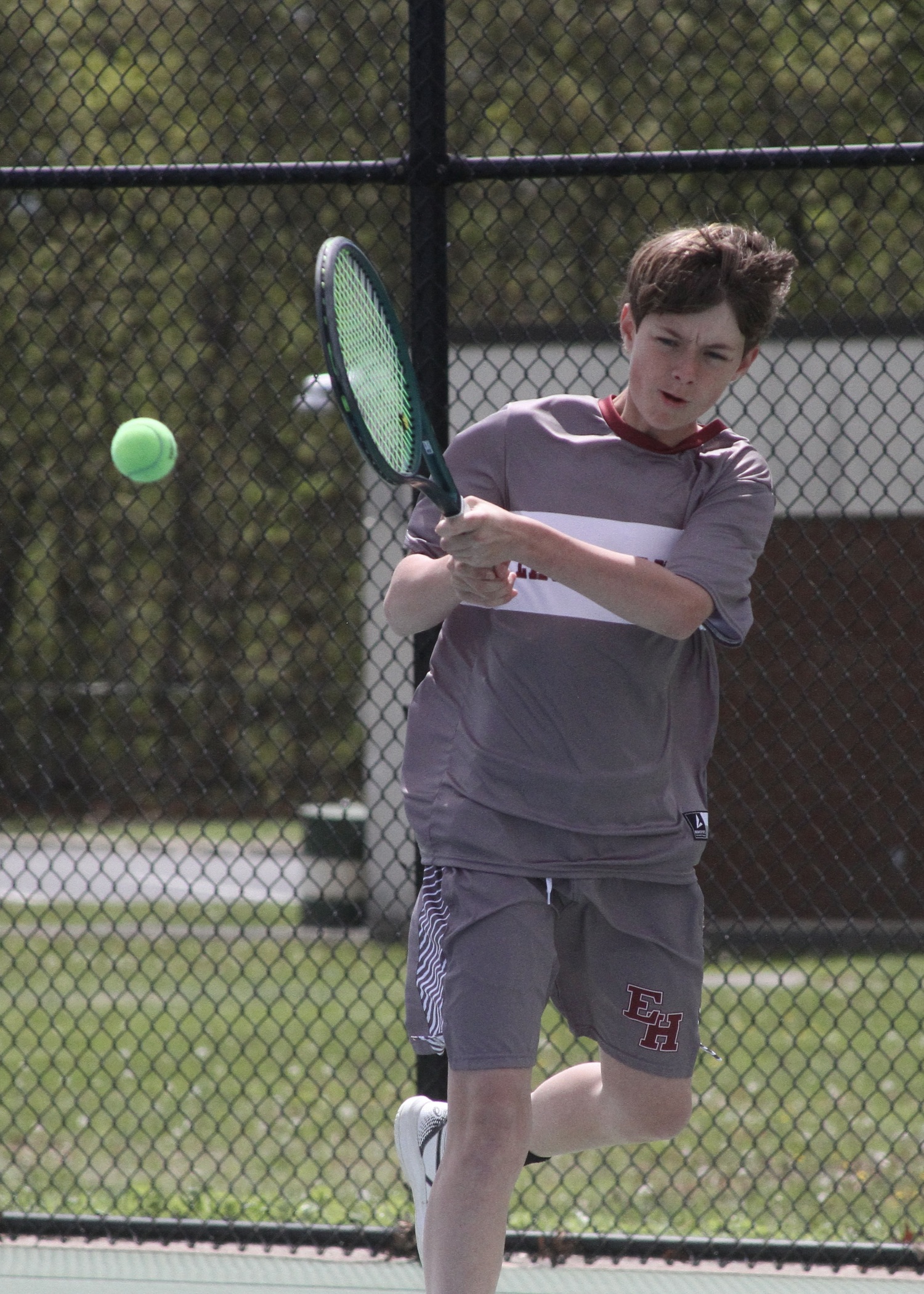 Eighth-grader Chase Bohnnsack launches the ball back over the net. DESIRÉE KEEGAN