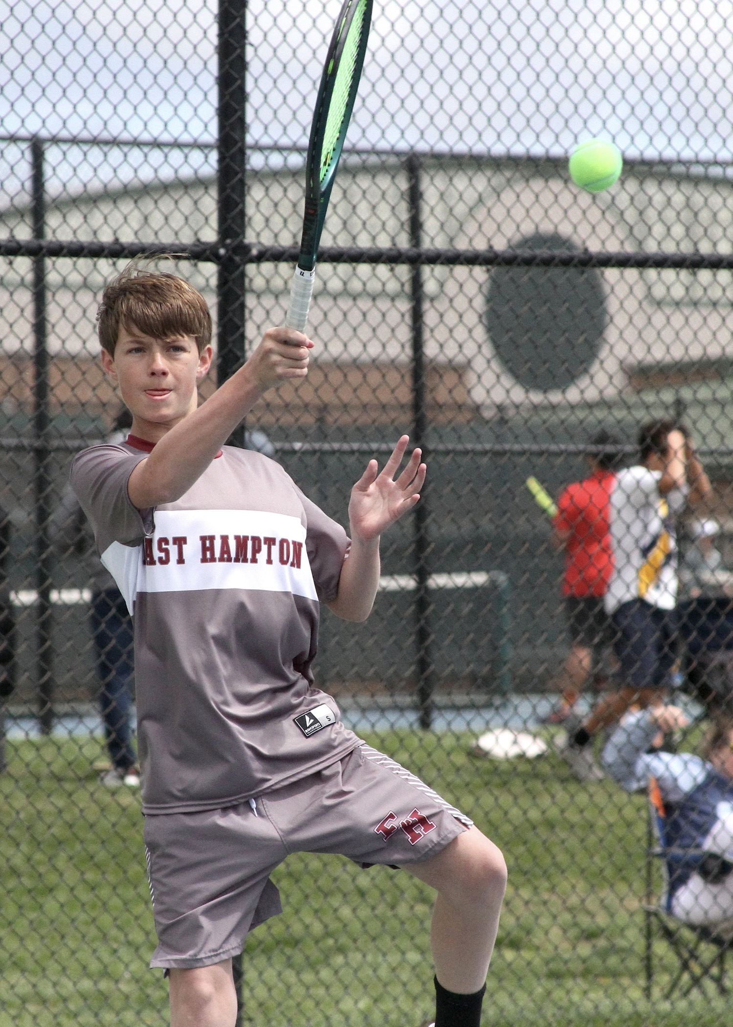 Eighth-grader Chase Bohnnsack pushes the ball back over the net. DESIRÉE KEEGAN
