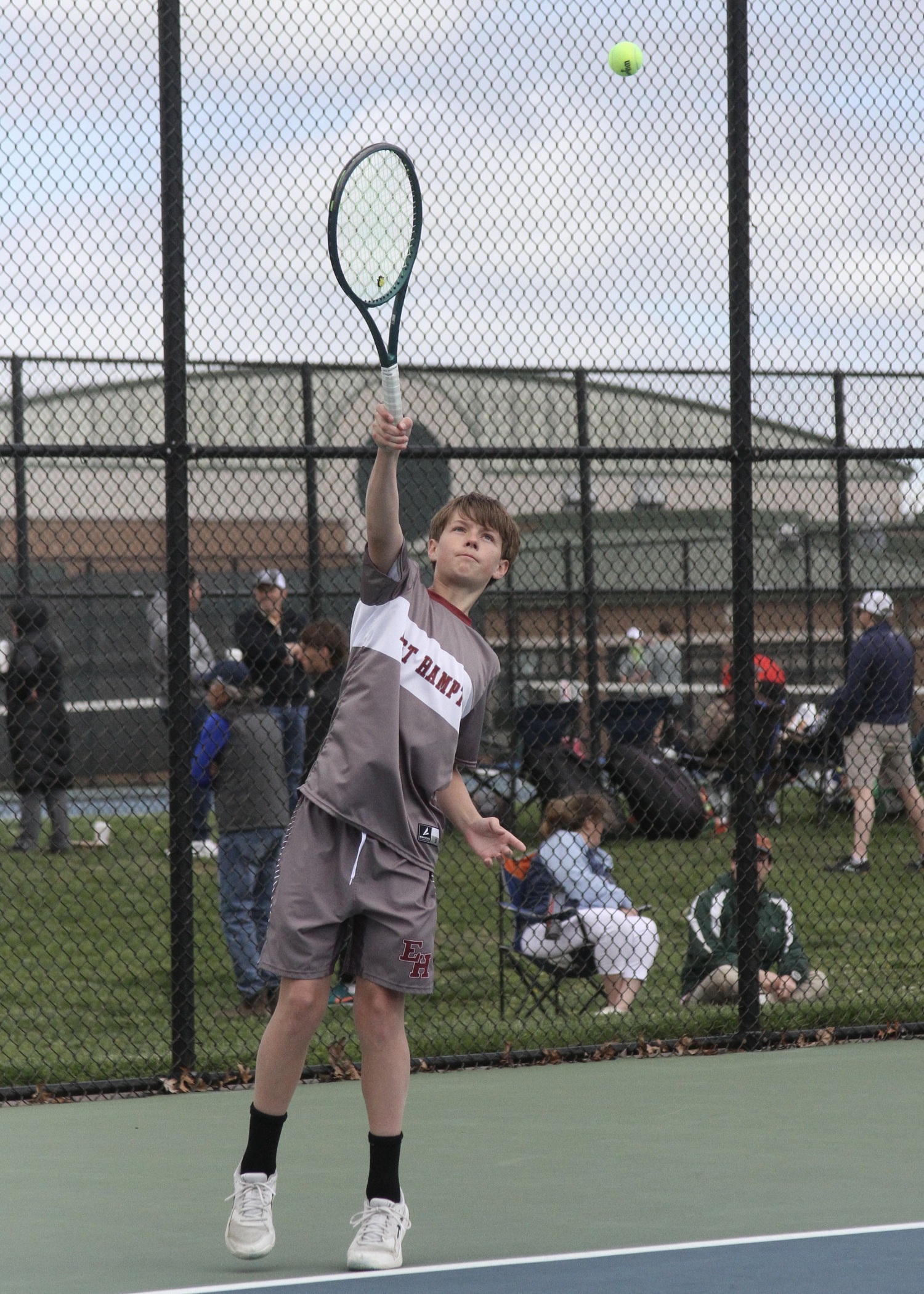 Eighth-grader Chase Bohnnsack serves. DESIRÉE KEEGAN
