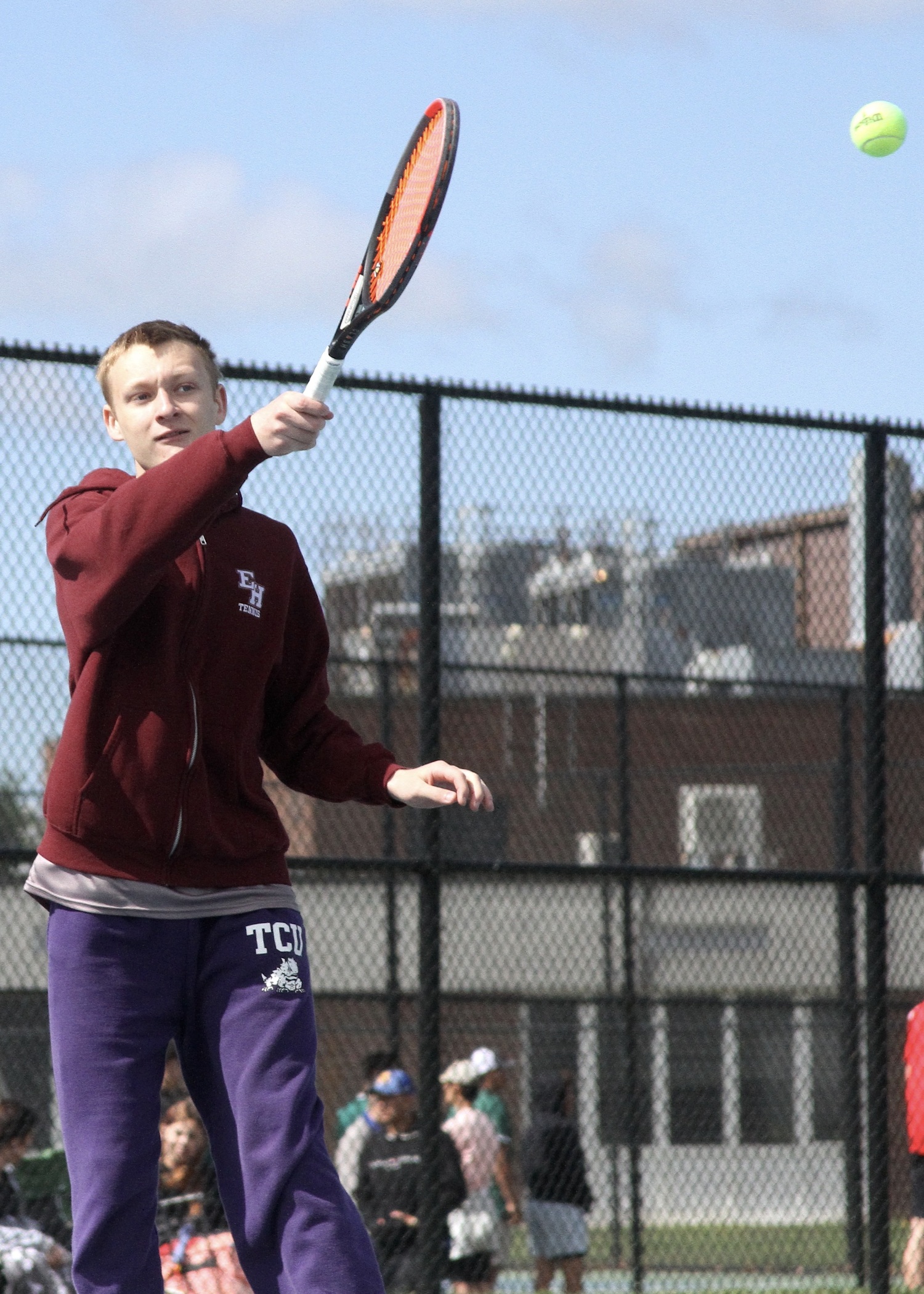 Senior Kiefer Mitchell sends the ball back over the net. DESIRÉE KEEGAN