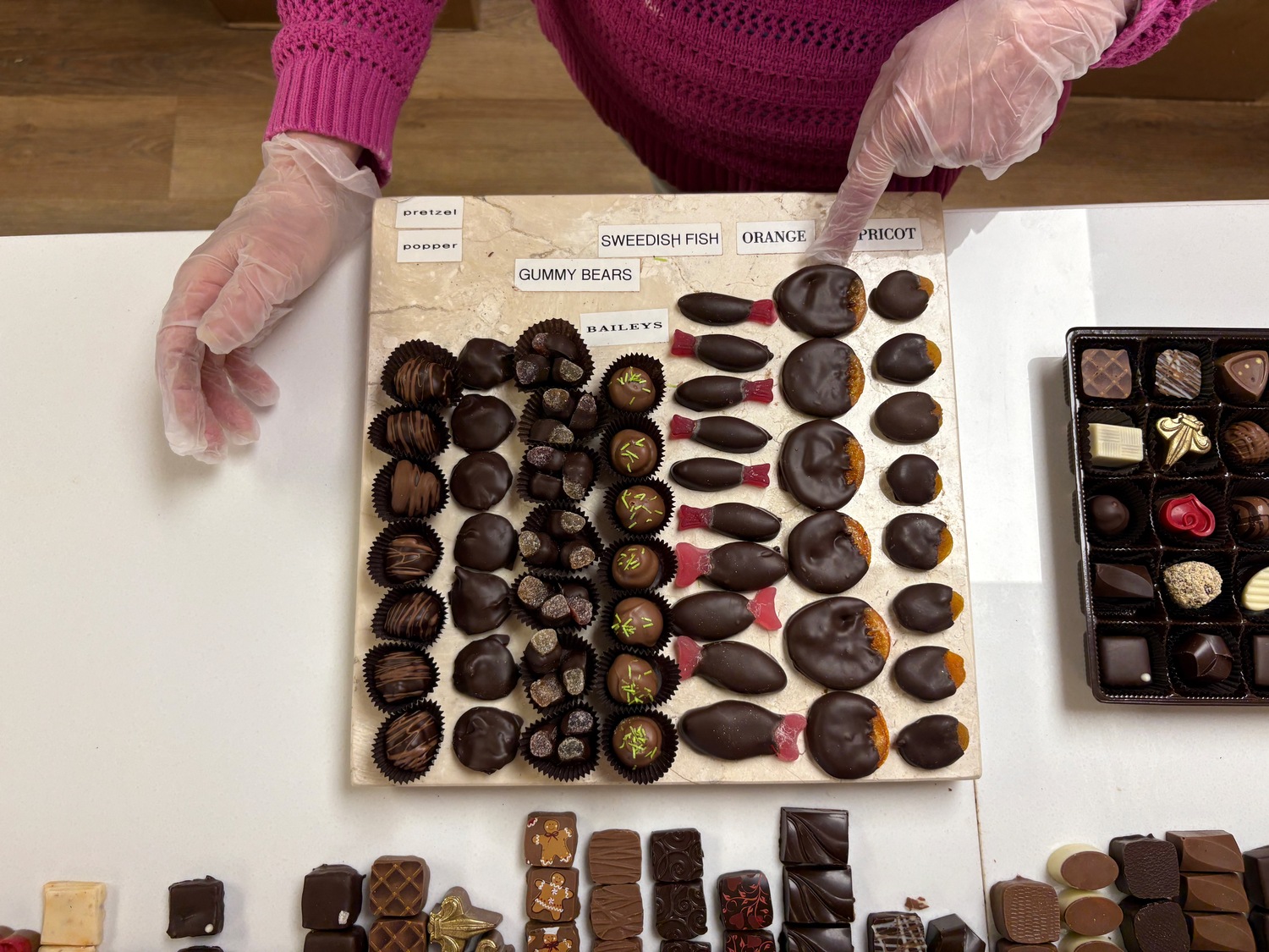 Ann Corley pointed out chocolate-dipped candied orange slices, which are made from scratch every step of the way in the North Fork Chocolate Company kitchen.