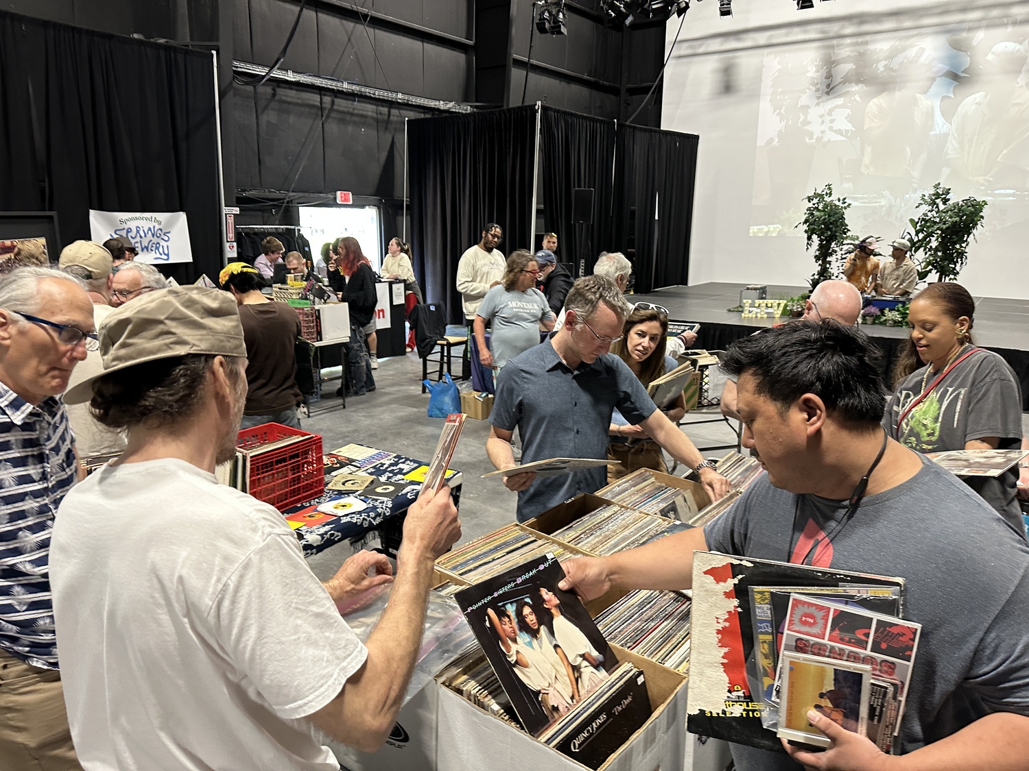 Guests browsing albums at the first annual Hamptons Vinyl Record Fair. DAN STARK