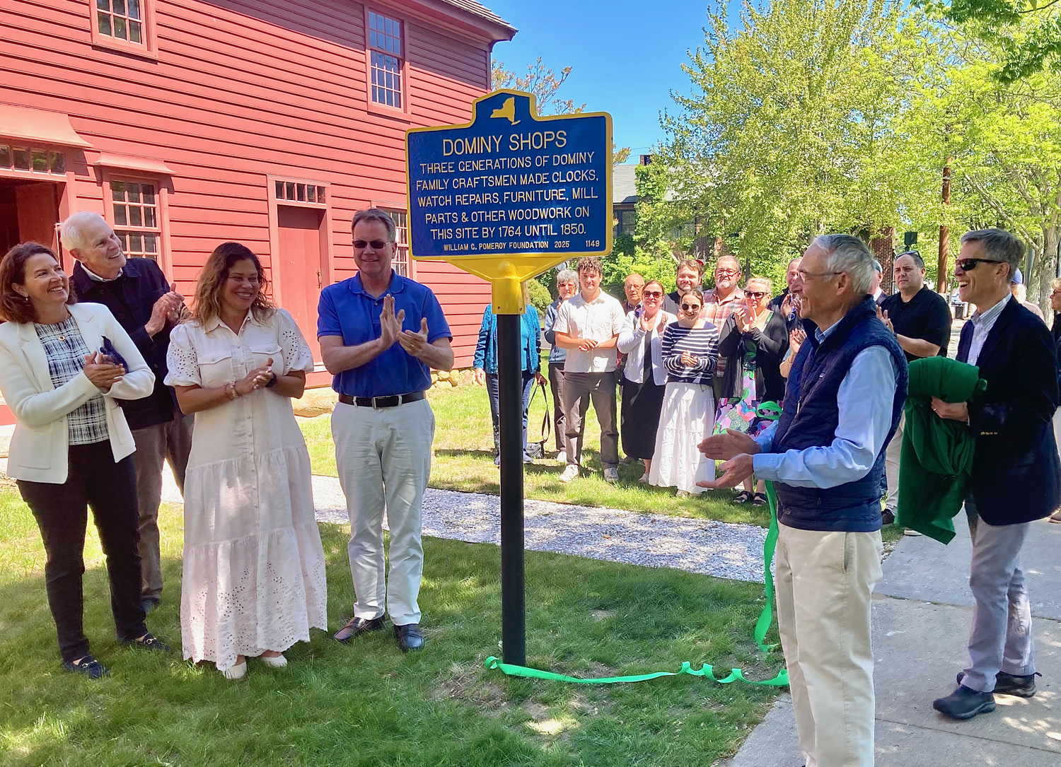 The Dominy Shops Museum was presented with a historical marker in a ceremony on May 19. The marker will join several others throughout East Hampton Town that have been sponsored by the Pomeroy Foundation. In addition to the new historical marker, the brief ceremony will celebrate the reinstallation of the American Bicentennial plaque that was placed on the property almost 50 years ago to commemorate the Dominy Shops. In attendance were East Hampton Mayor Jerry Larsen, members of the East Hampton Village Board, Historical Society President Debbie Druker and additional members of the Board of Trustees, Town and Village Historian Hugh King, and Dominy Shops Project Director, Bob Hefner.  KYRIL BROMLEY