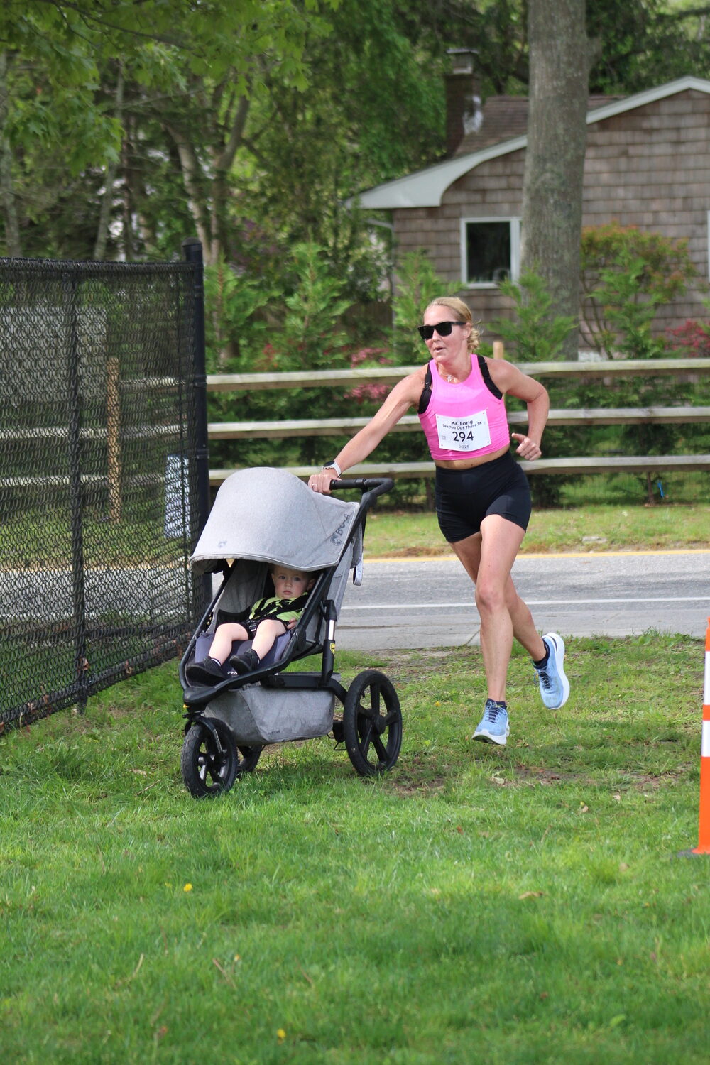 Mary McKeon heads toward the finish line, with a stroller.   MACKENZIE DAVID