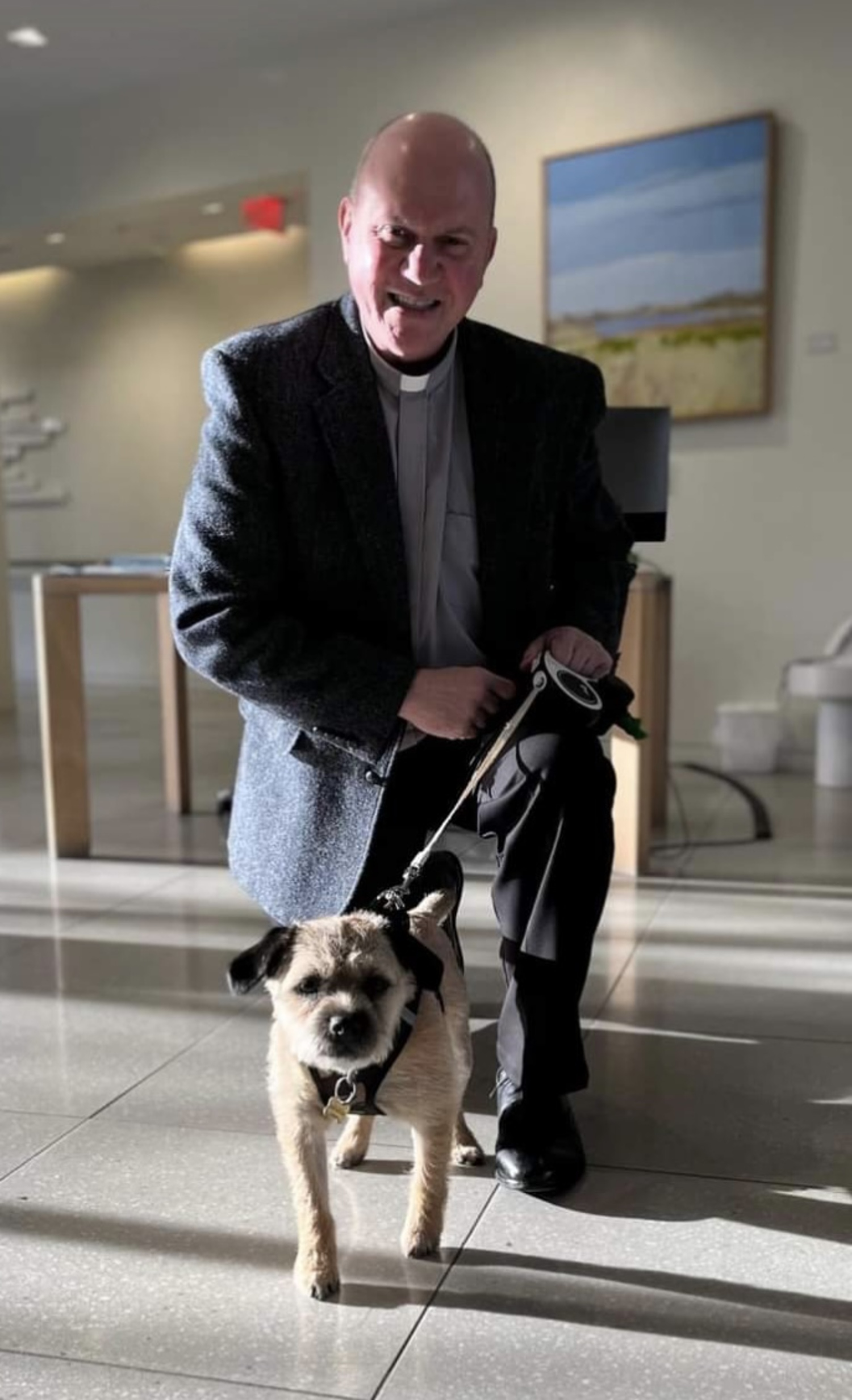 Father Ken Grooms, pastor of the Immaculate Conception Church in Westhampton Beach, with his dog, Teddy.