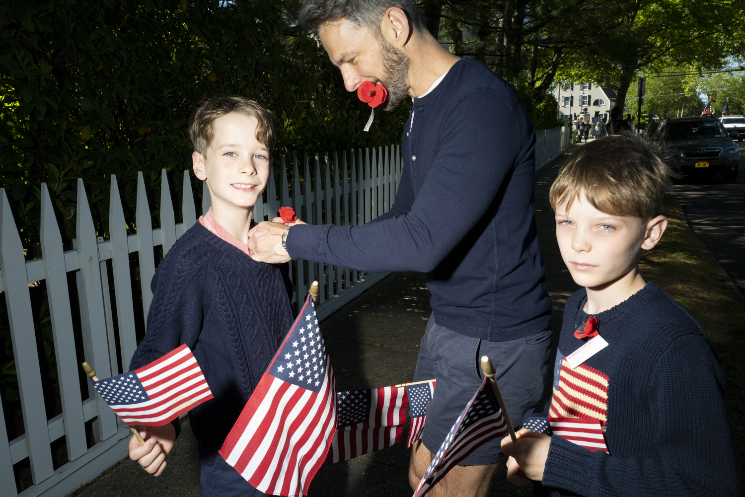 Alex Peruzzi, with his sons Grey and Auguste, at Sag Harbor's Memorial Day observance. LORI HAWKINS