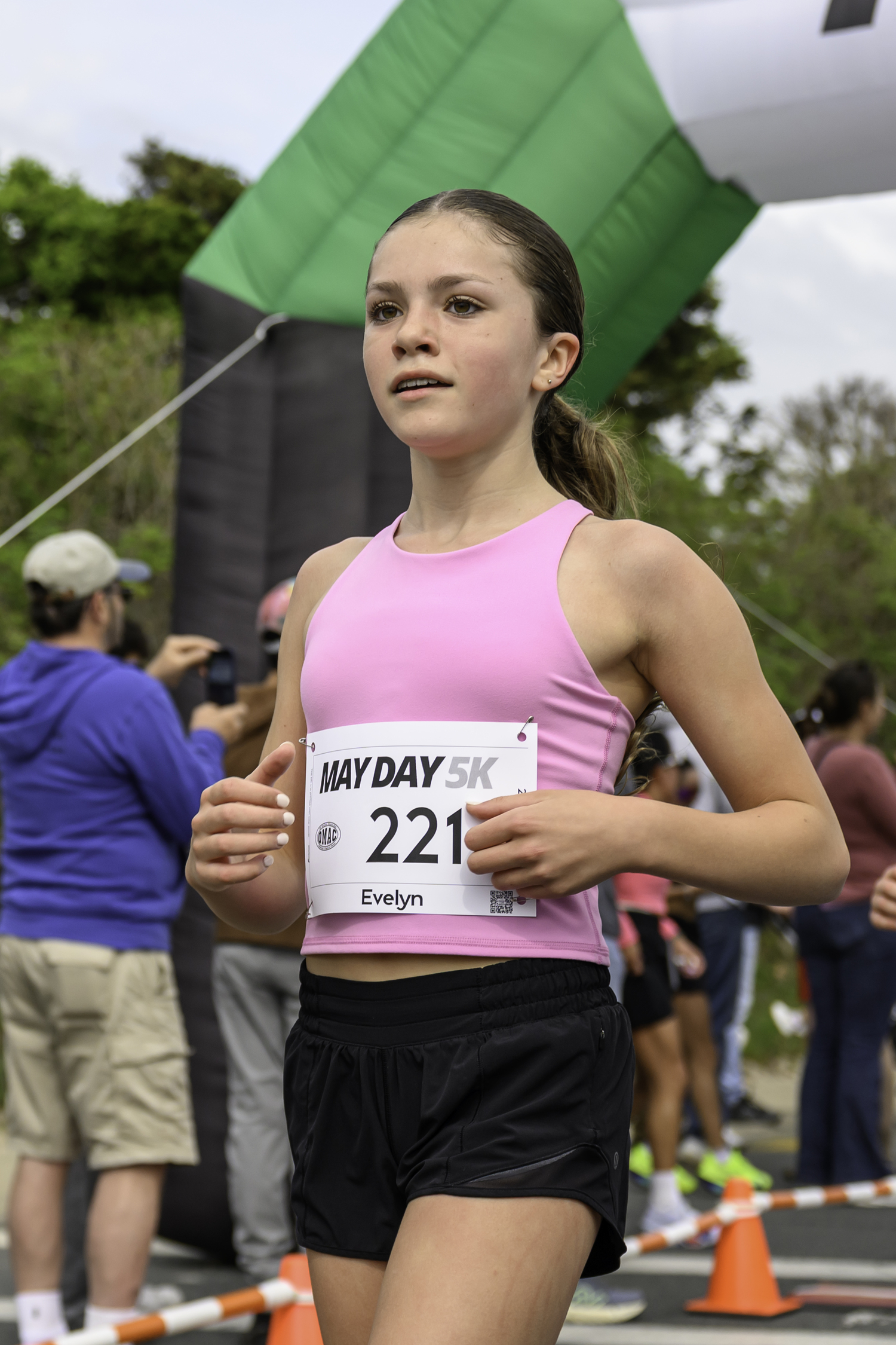 Evelyn Rizzo crosses the finish line.  MARIANNE BARNETT