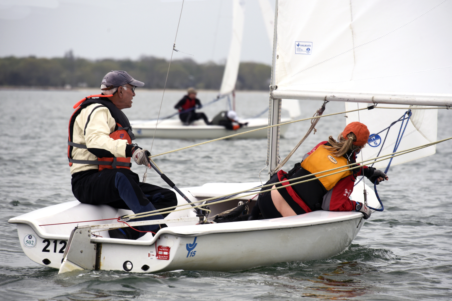 Lee Oldak, here on his JY15 and throughout the summer skippering Purple Haze, exhibits the concentration needed to win, while Sarah Alford fine-tunes the jib. MICHAEL MELLA