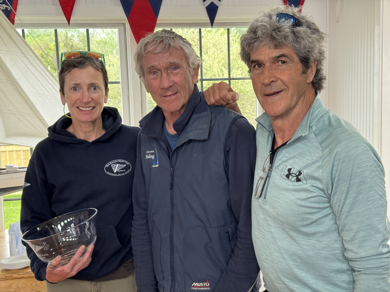 David Whelen and Sinéad FitzGibbon took home the gold in Sunday's JY15 regatta, crossing the finish line first in four of the six races. The award was presented by fleet caption and former club commodore Bud Rodgers, who earlier aided the current commodore, Nick Gazzolo, tally the score aboard the race committee motor yacht Sweet Pea, skippered by Marty Knab.   MICHAEL MELLA