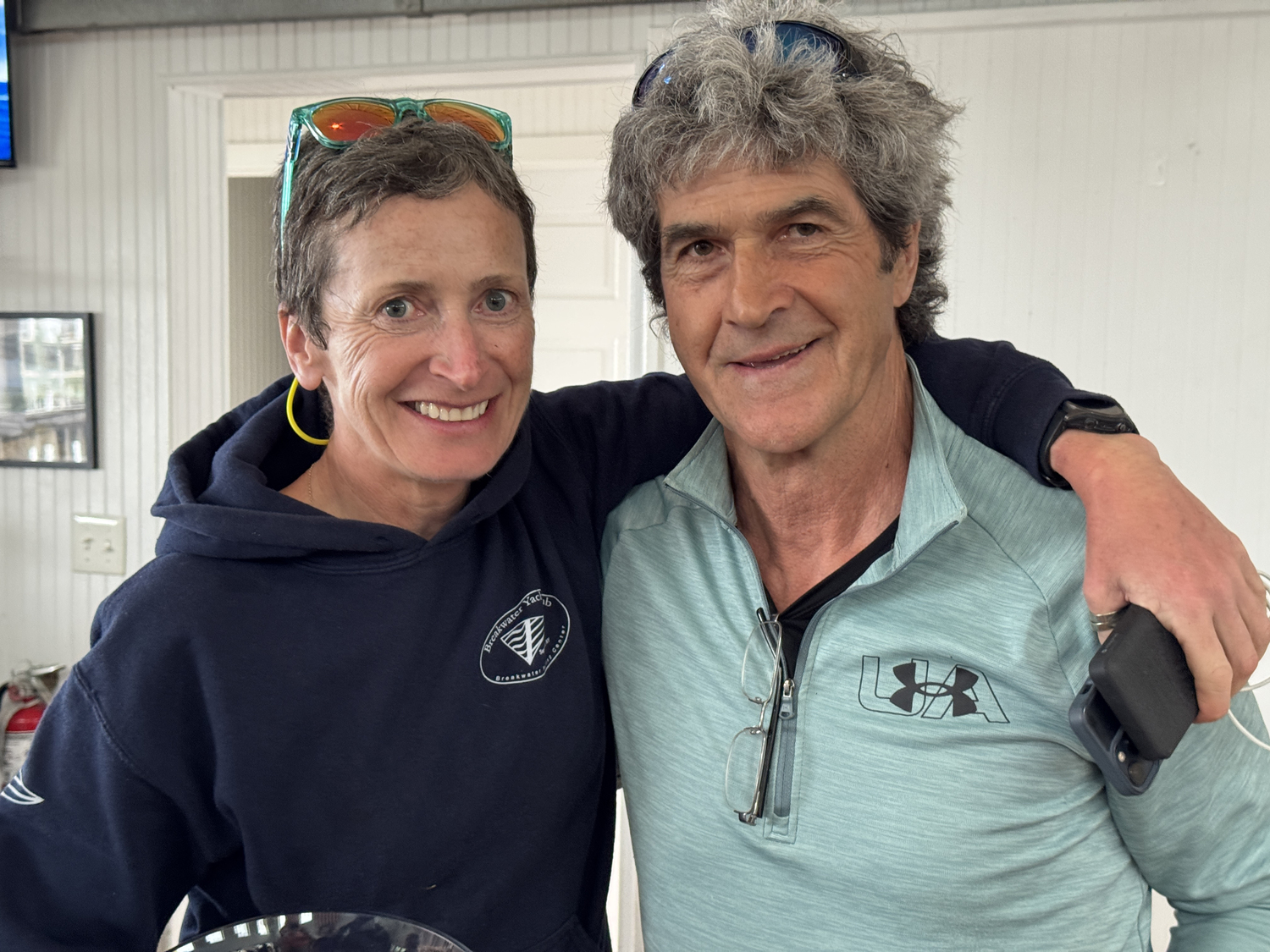 David Whelen and Sinéad FitzGibbon took home the gold in Sunday's JY15 regatta, crossing the finish line first in four of the six races. The award was presented by fleet caption and former club commodore Bud Rodgers, who earlier aided the current commodore, Nick Gazzolo, tally the score aboard the race committee motor yacht Sweet Pea, skippered by Marty Knab.   MICHAEL MELLA