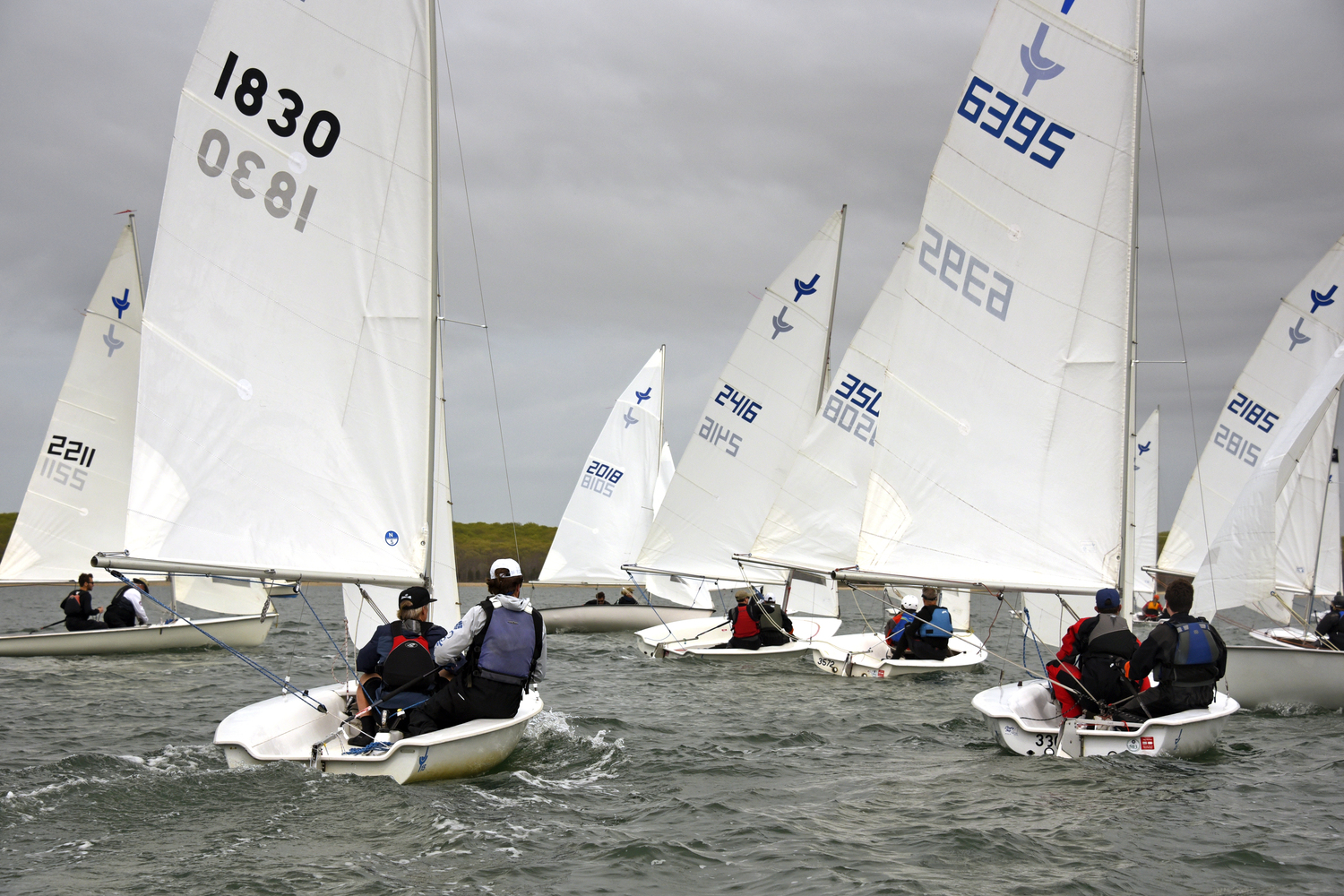 Boats heading for the gybe mark, sails eased for the broad reach. MICHAEL MELLA