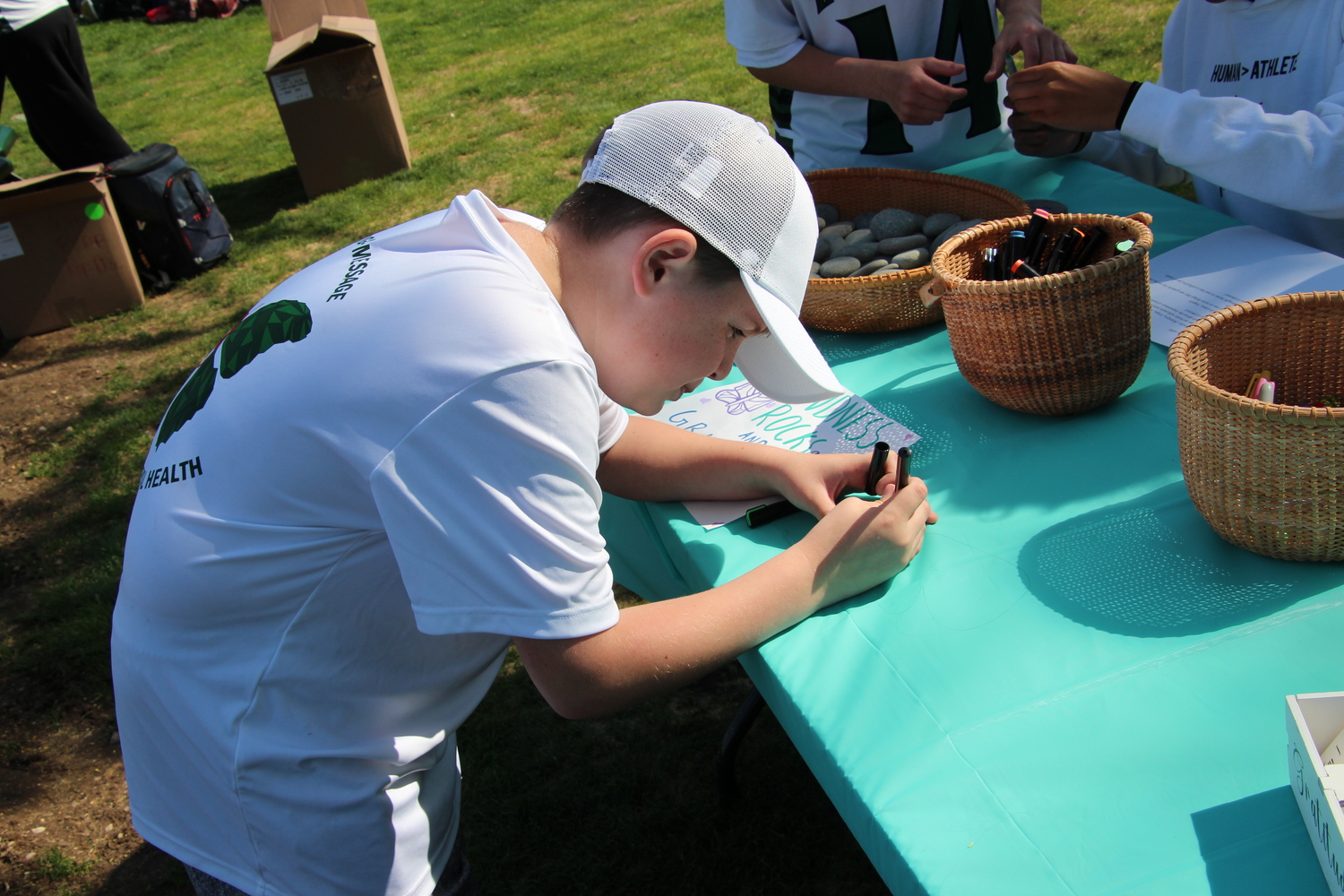Kindness rocks were decorated during Westhampton Beach's May 2 game against Rocky Point as part of a partnership between the girls lacrosse team and the nonprofit Morgan's Message, which focuses on mental health in athletics. MARY BEASLEY