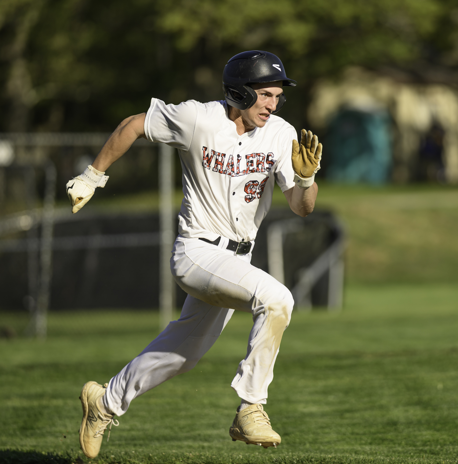 Lucas Iulo sprints to first base.  MARIANNE BARNETT