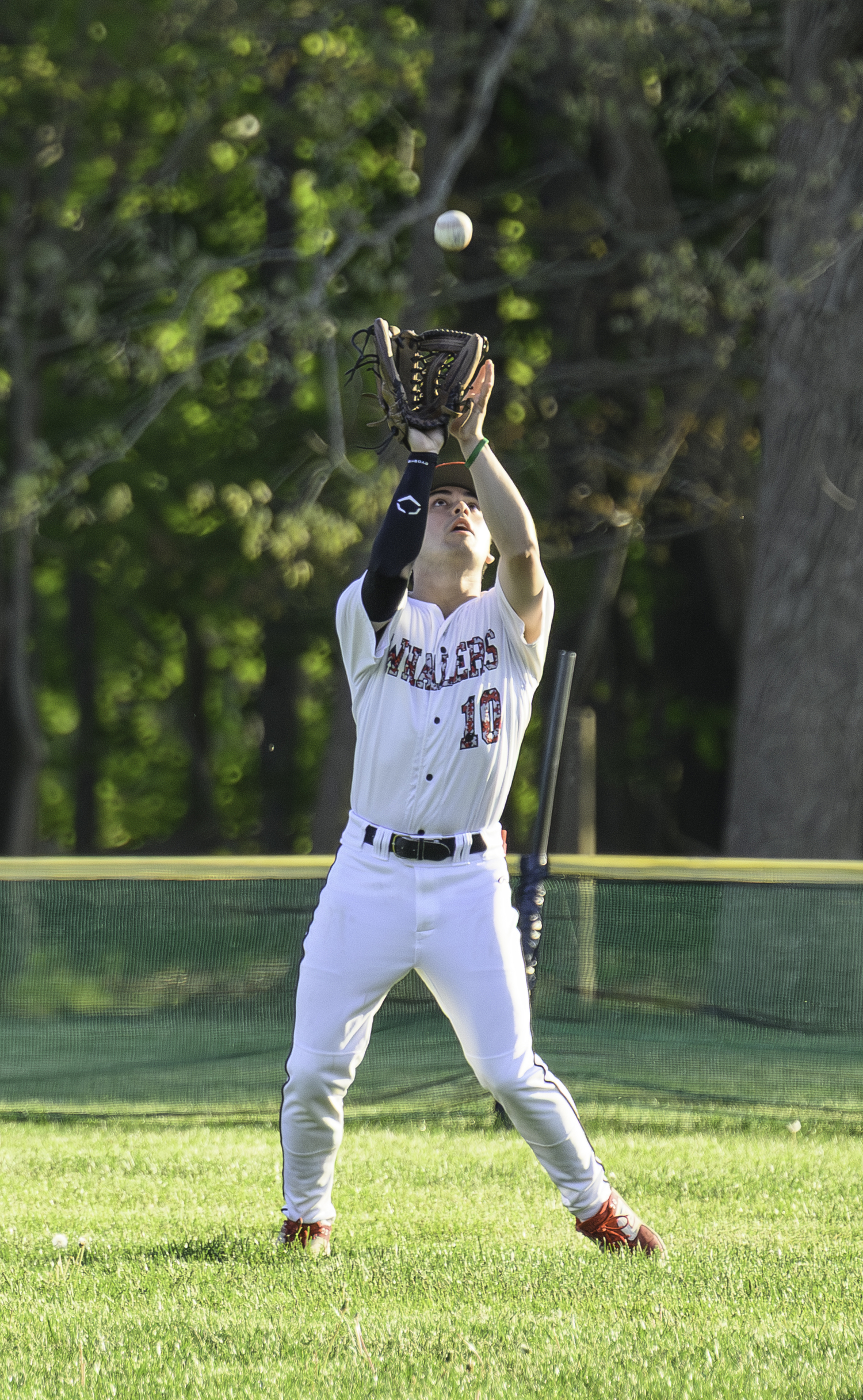 Pierson senior Max Krotman settles underneath a fly ball for an out.   MARIANNE BARNETT