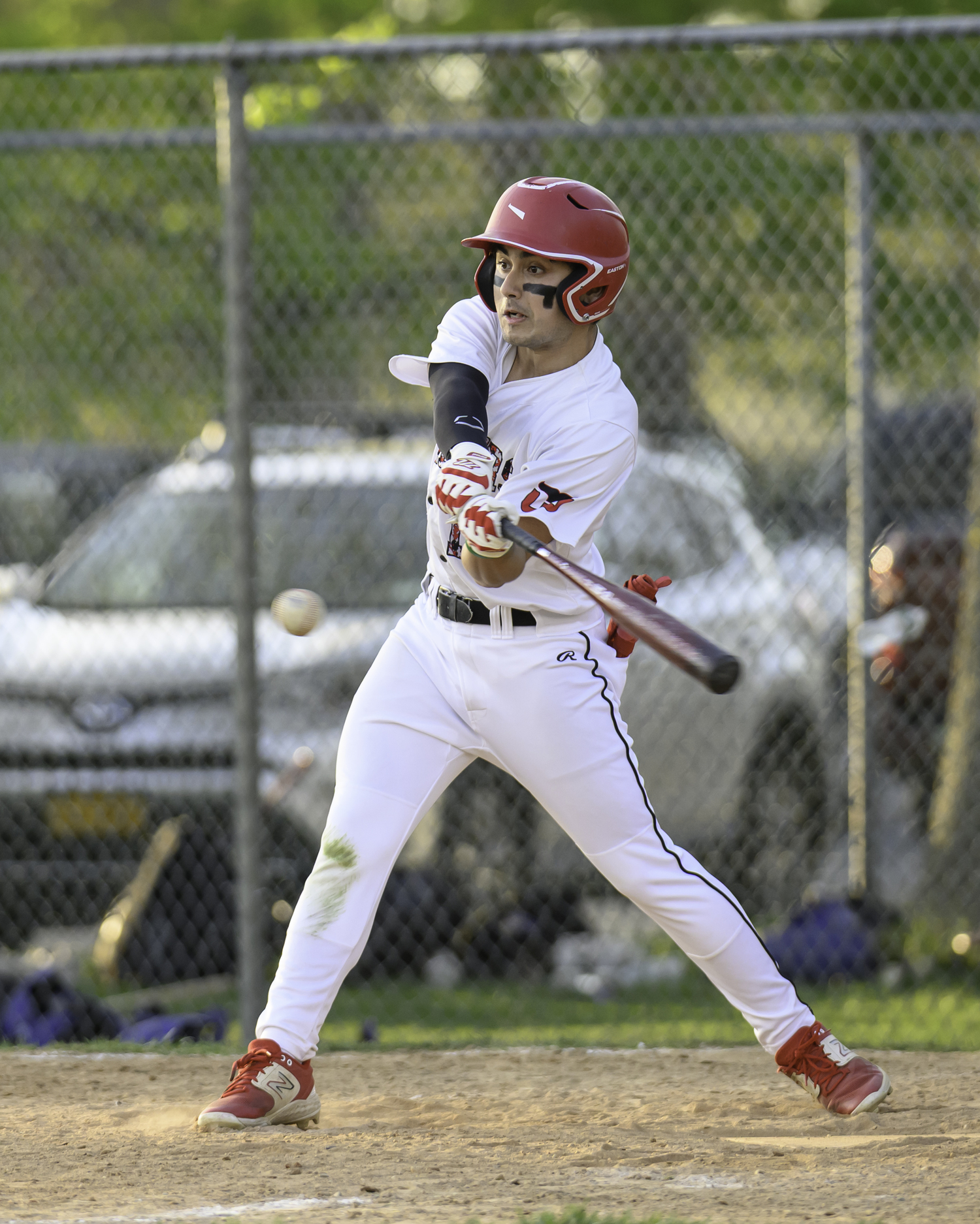 Max Krotman puts a ball in play that gets him on base in the eighth inning.   MARIANNE BARNETT