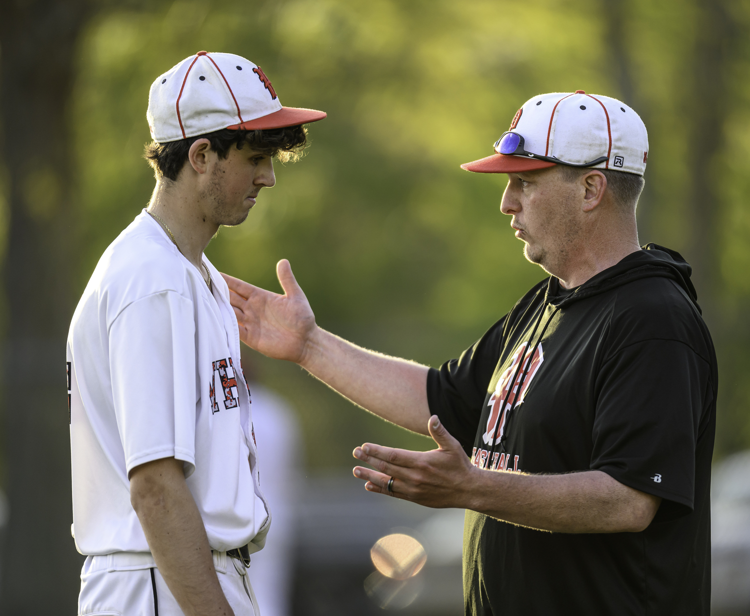 Pierson head coach Bob Manning explains the game's final play to Braeden Mott.  MARIANNE BARNETT