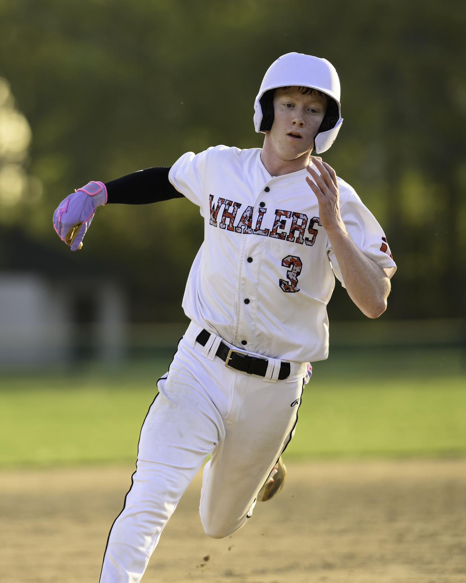 Spencer Cavaniola rounds third base and heads home to score the game-winning run on Friday.   MARIANNE BARNETT