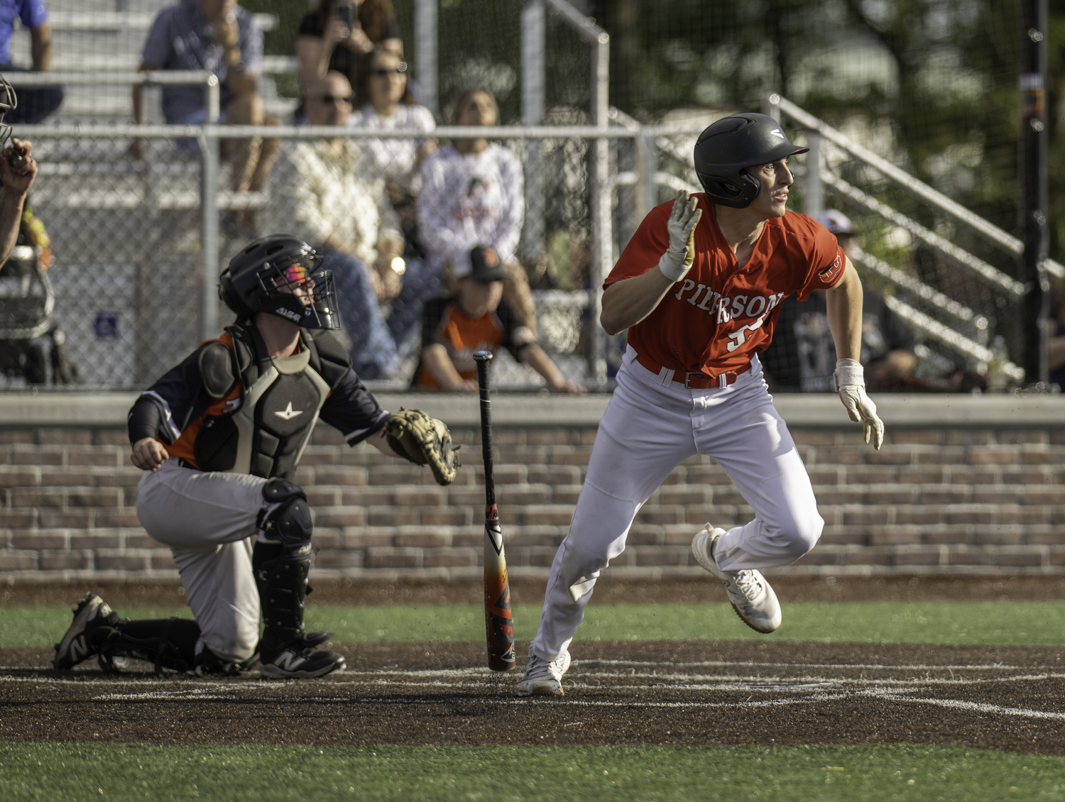 Senior outfielder Lucas Iulo rushes out of the batter's box. MARIANNE BARNETT