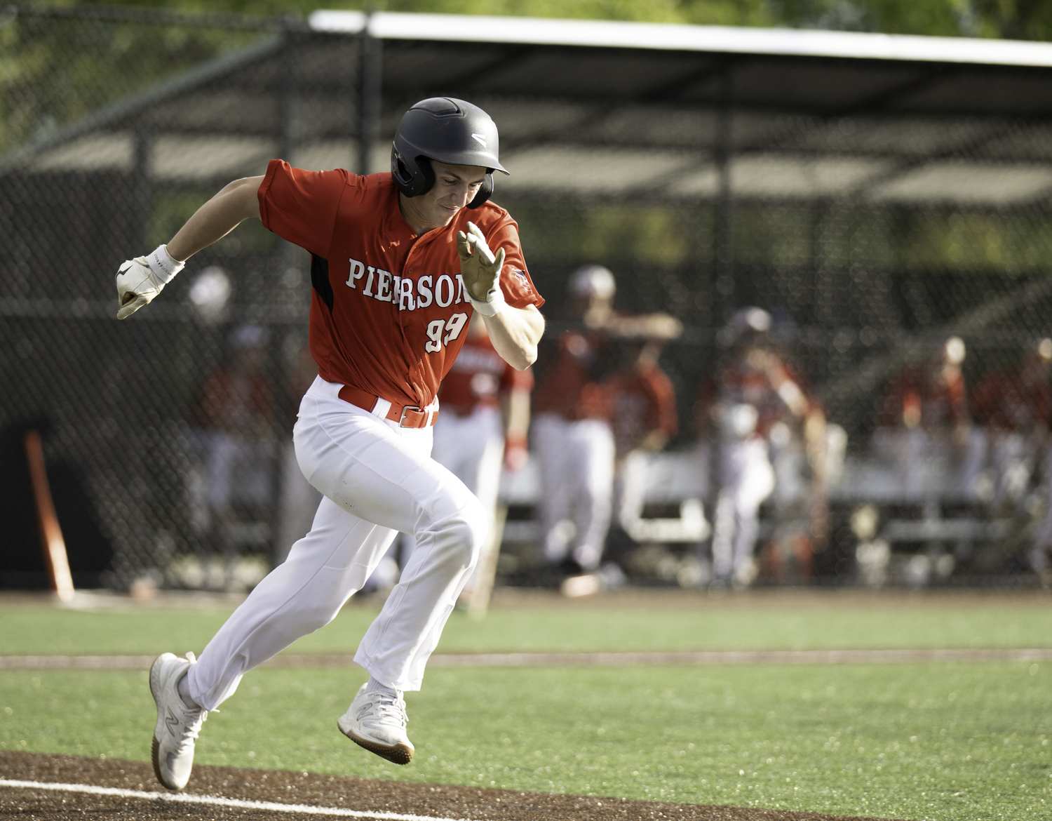 Senior outfielder Lucas Iulo dashes toward first. MARIANNE BARNETT
