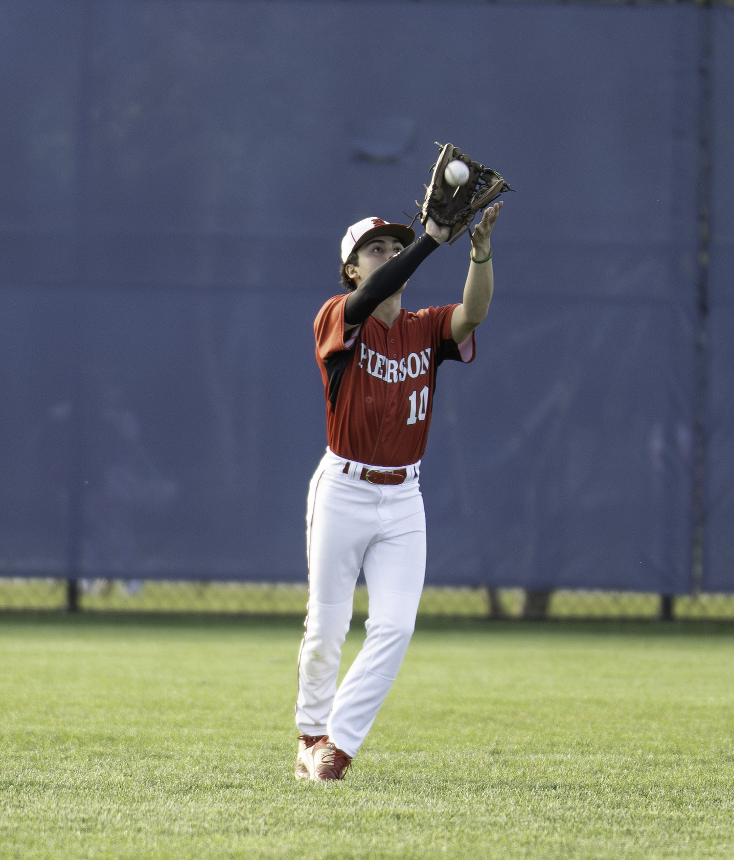 Senior center fielder Max Krotman grabs an out. MARIANNE BARNETT