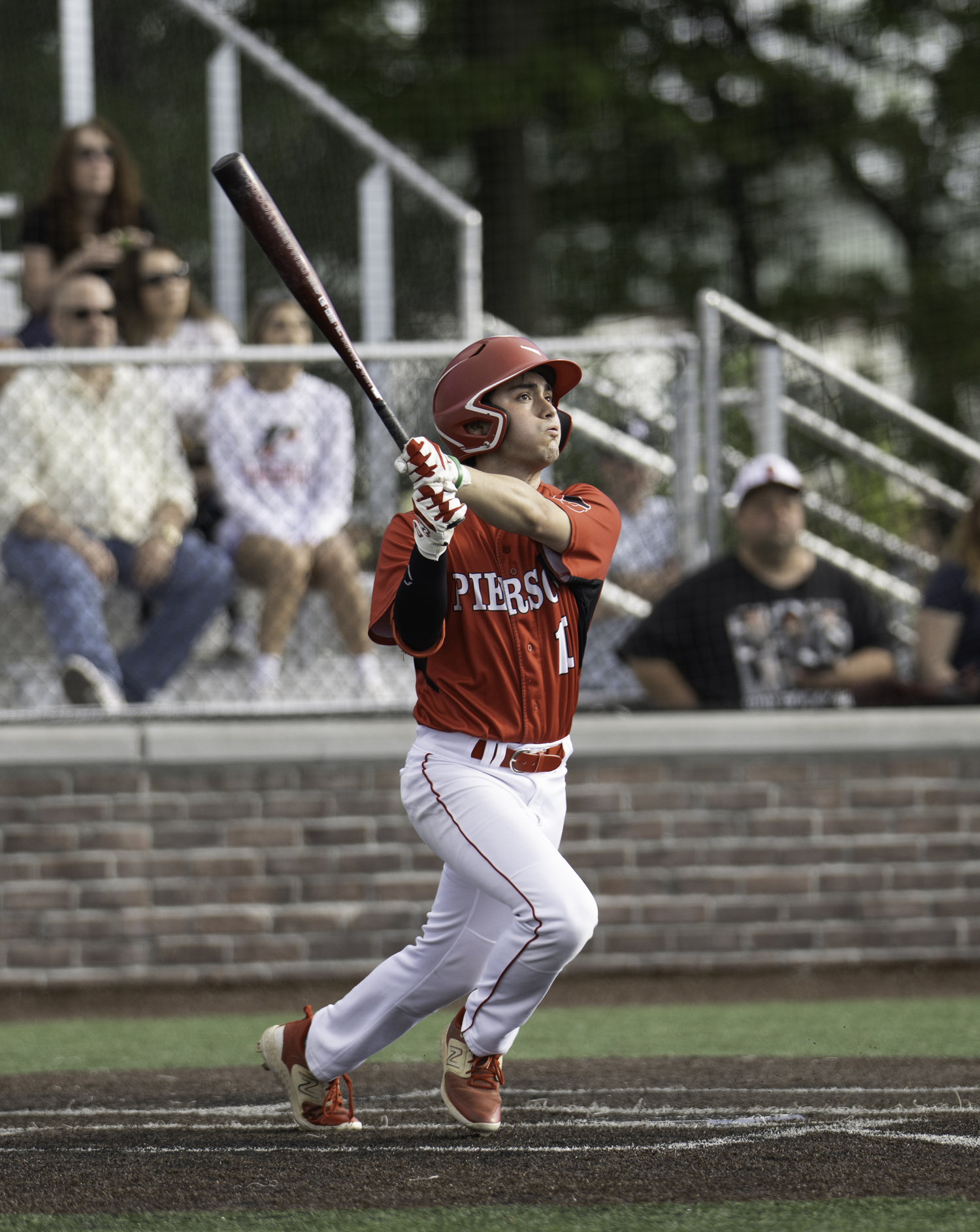 Senior center fielder Max Krotman hits a fly ball. MARIANNE BARNETT