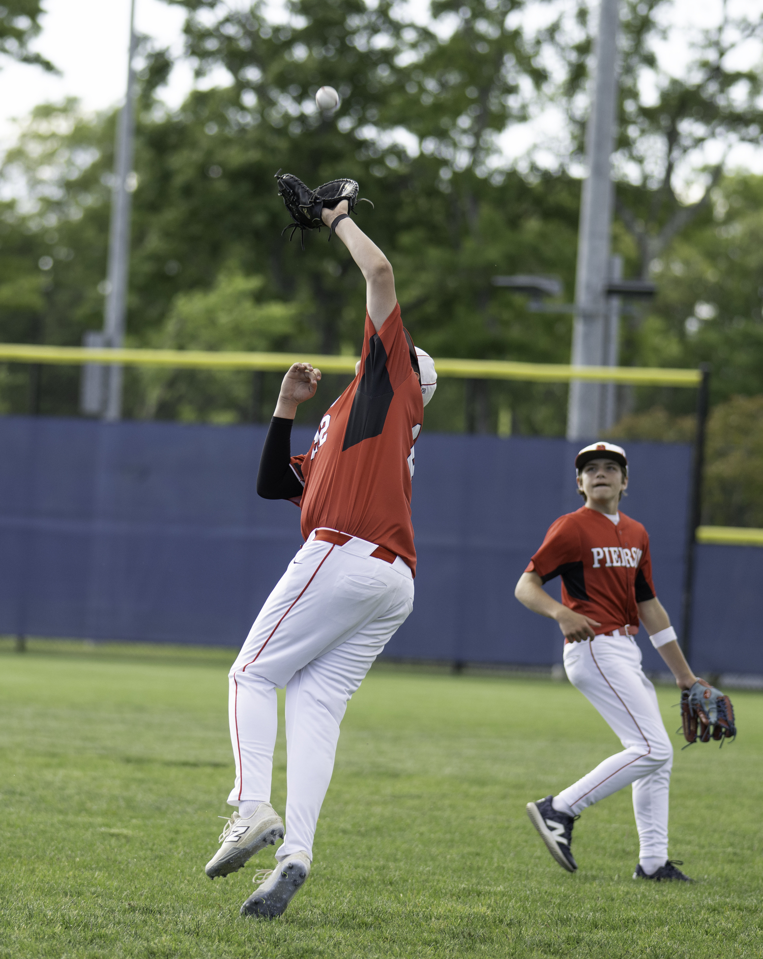 Senior first baseman Paul Roesel grabs an out. MARIANNE BARNETT