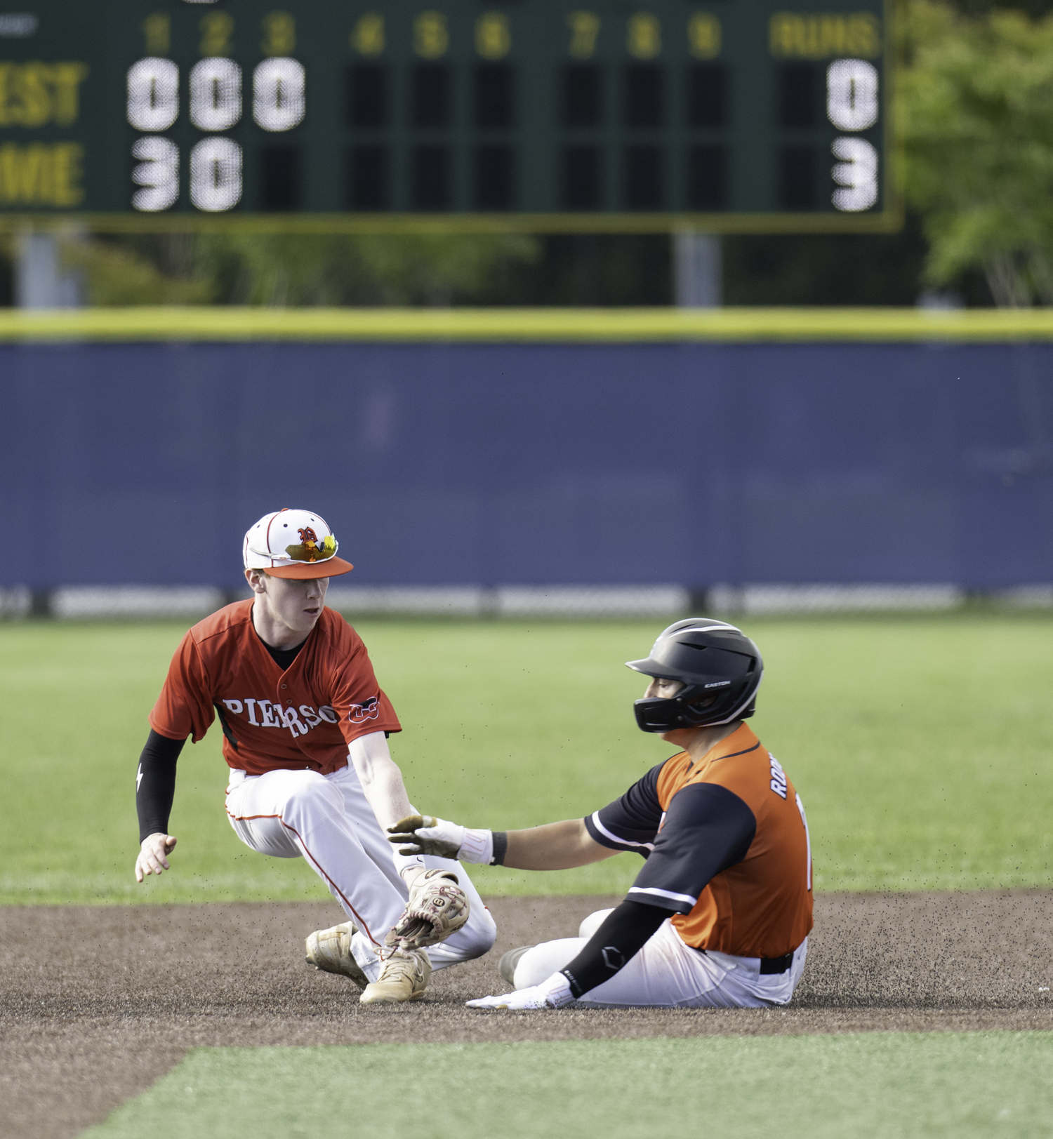 Junior short stop Spencer Cavaniola tags a runner out. MARIANNE BARNETT