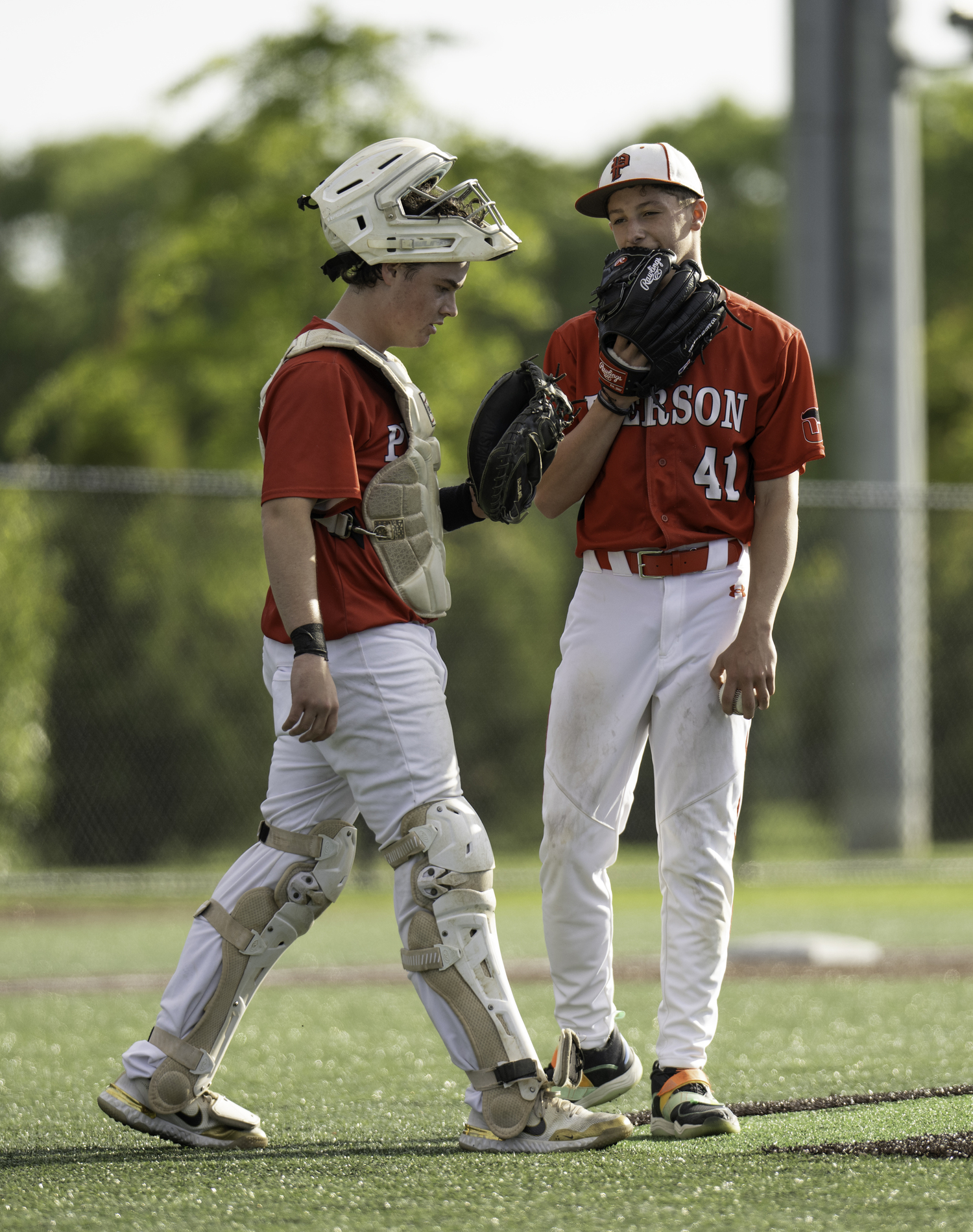 Pierson catcher Jeffrey Gregor talks with his starting pitcher Andy Wayne, who struck out a better to end an inning following their conversation.   MARIANNE BARNETT
