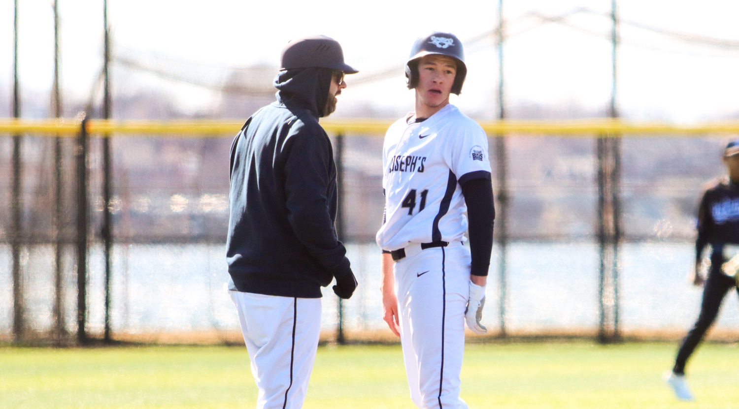 Rich Pecoraro speaks with one of his players, Doug Paider, during a game earlier this season.   HAYDEN REIS