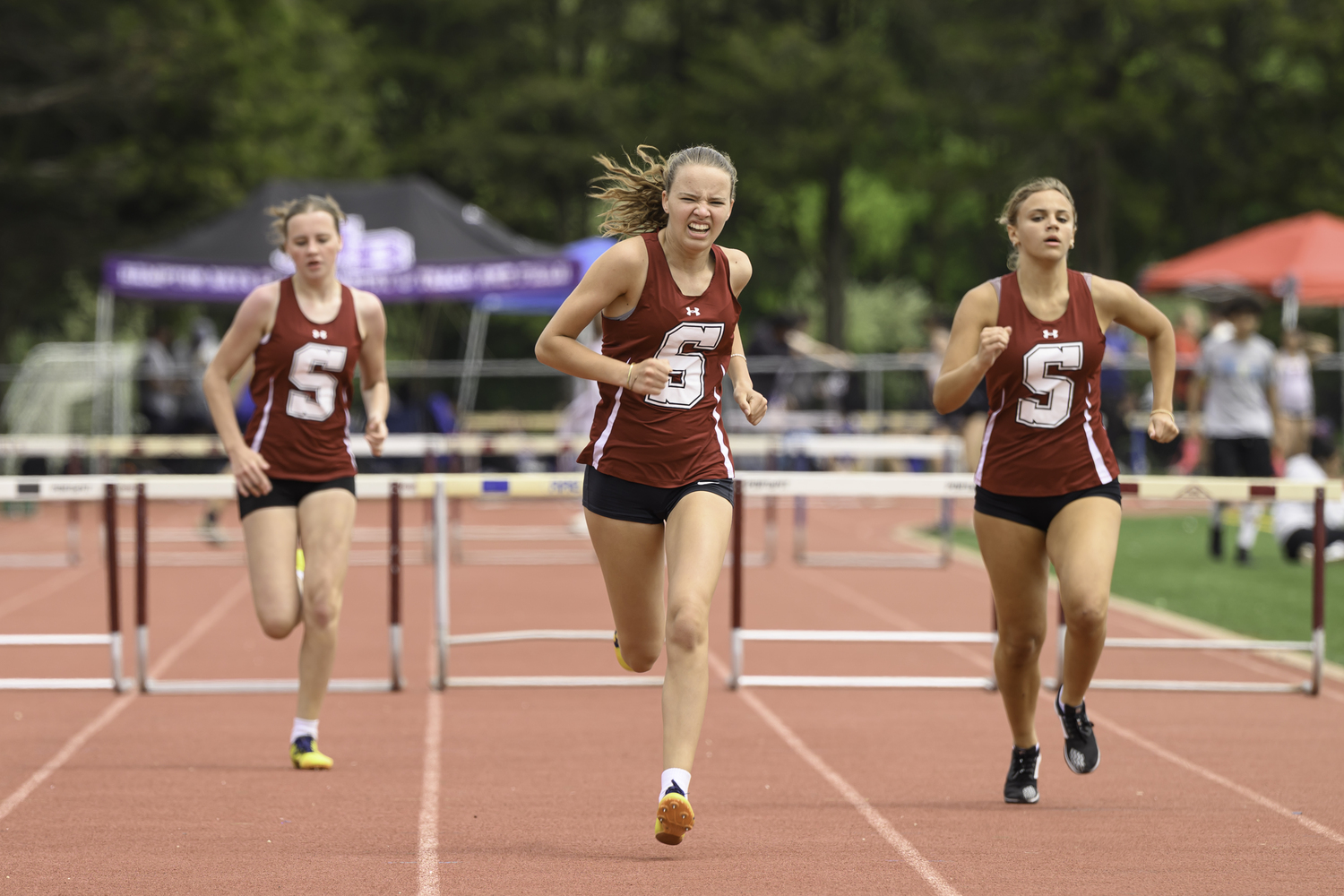 Mia Vijfvinkel lead sister Eva Vijfvinkel and teammate Olivia Koszalka in the 400-meter hurdles.  MARIANNE BARNETT