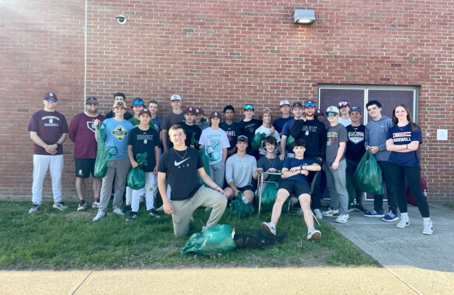 The varsity and junior varsity teams from Southampton High School and Southampton Intermediate School recently came together to volunteer as part of the Southampton Town 2025 Great East End Cleanup. The team members worked to collect garbage and clean up the area all around the high school. COURTESY SOUTHAMPTON SCHOOL DISTRICT